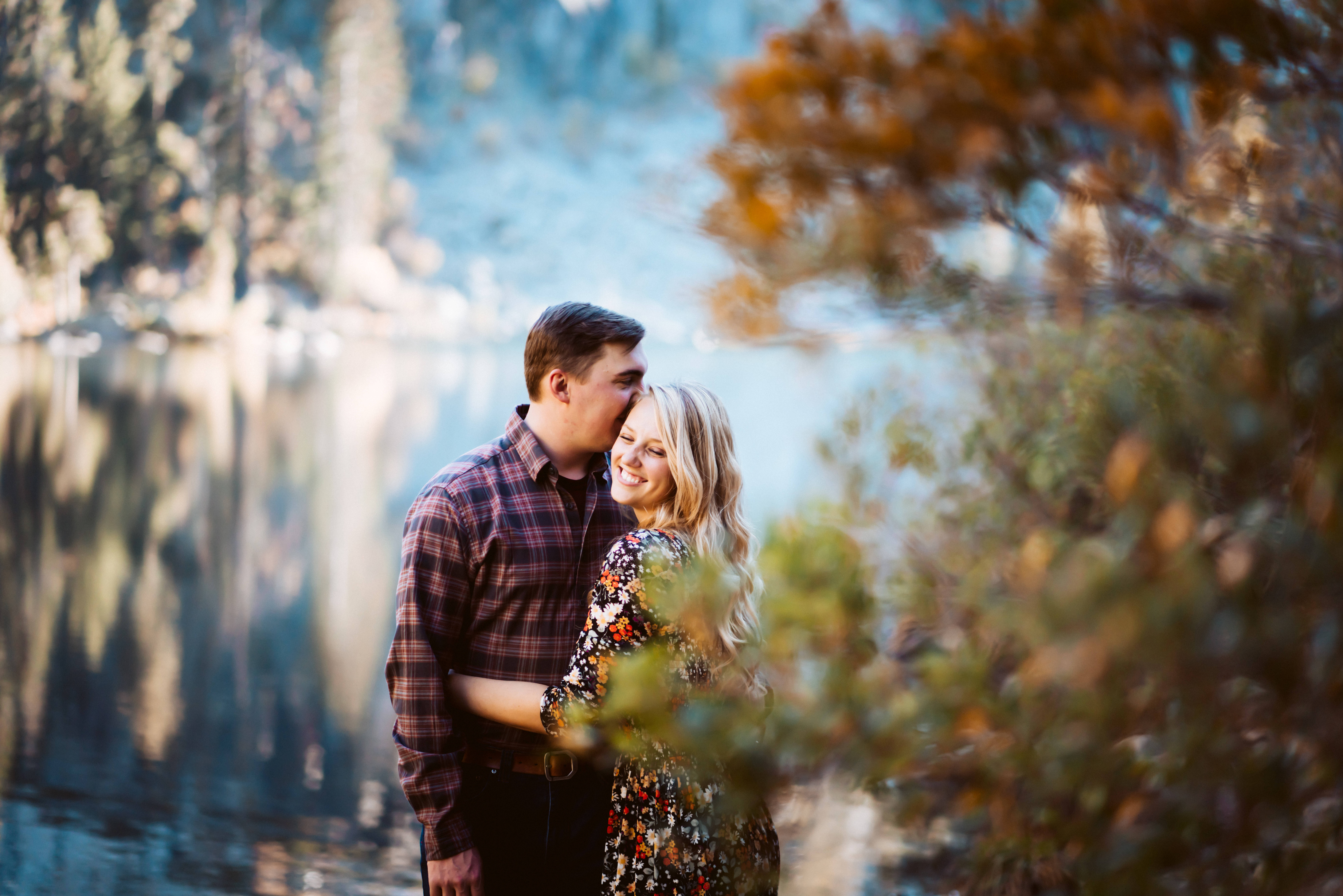 a boy kissing his fiance during their Lake Tahoe Engagement Photos