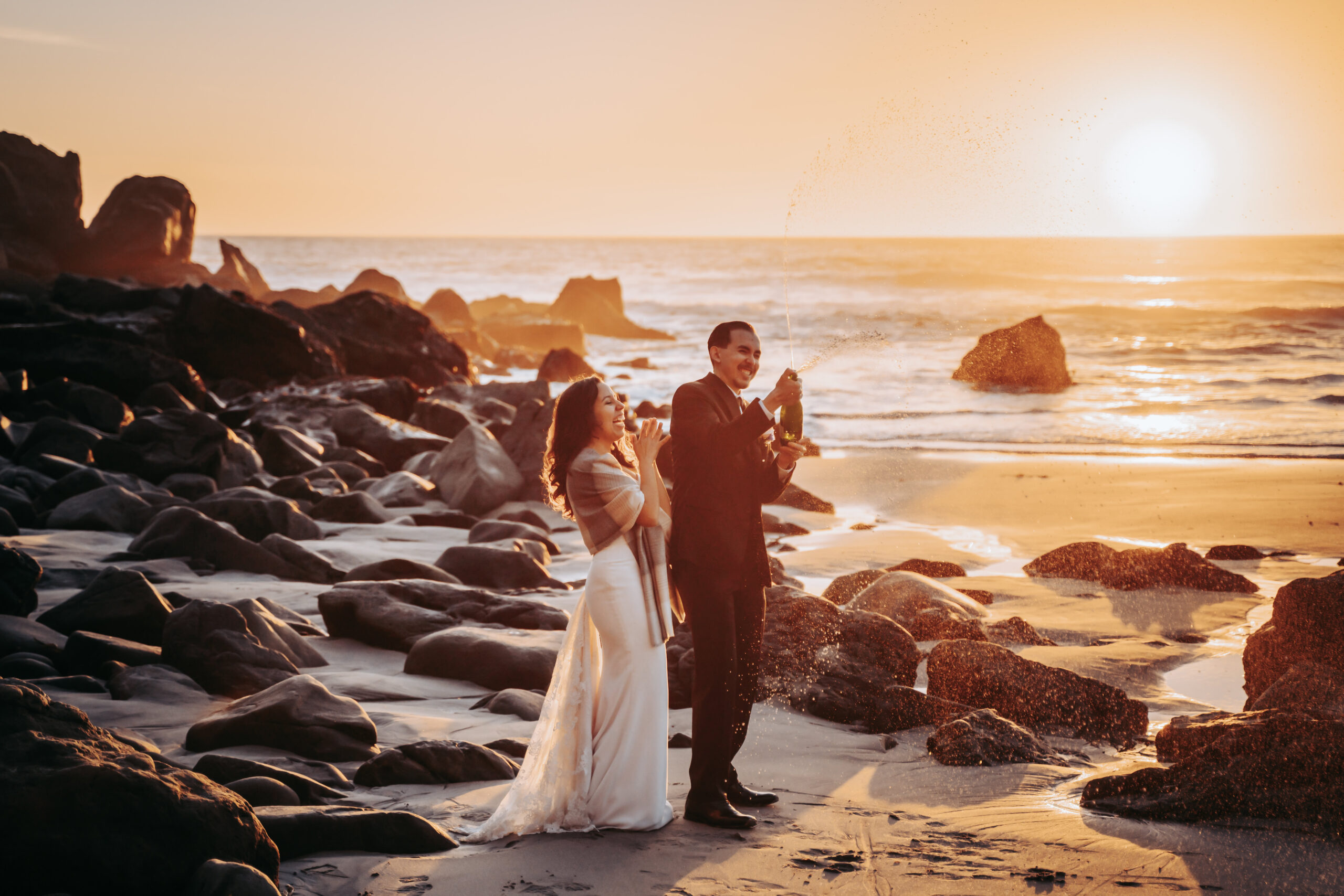 champagne pop at sunset for a couples Big Sur Sunset Elopement