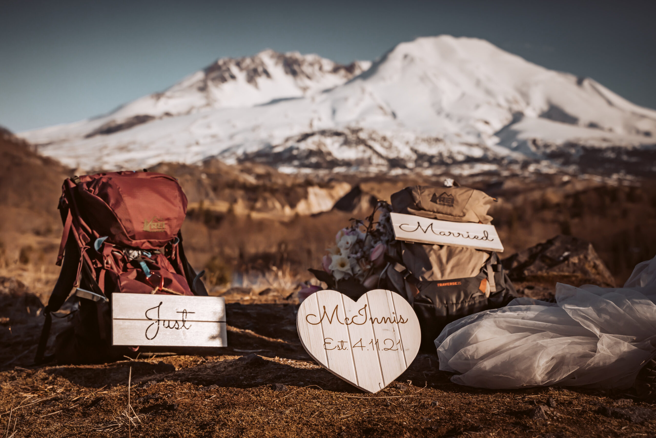 hiking backpacks and elopement signs