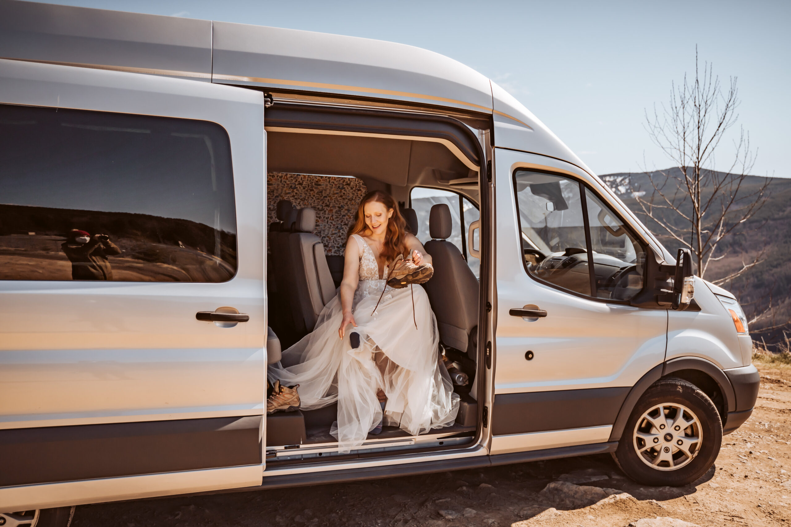a bride getting ready in her sprinter van for her mount saint helen elopement