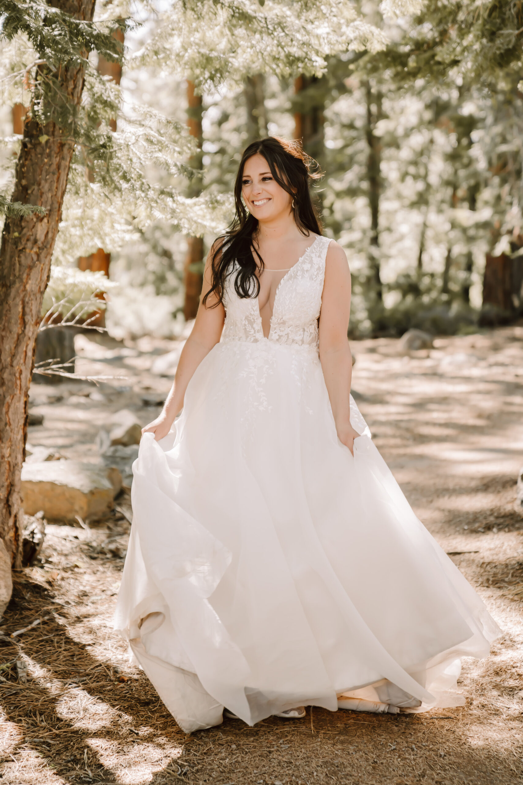 A bride swaying in her flowy elopement dress
