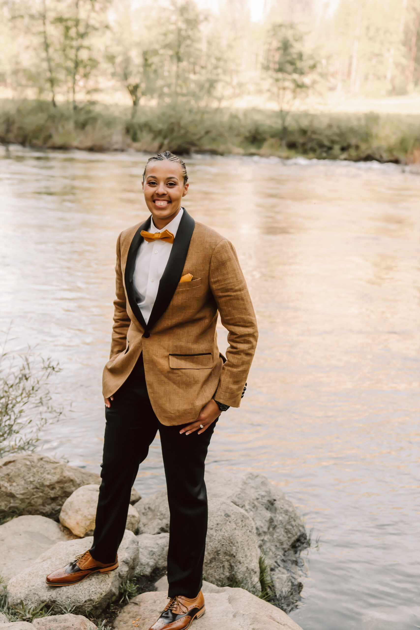 A bride in a brown tux on her elopement day