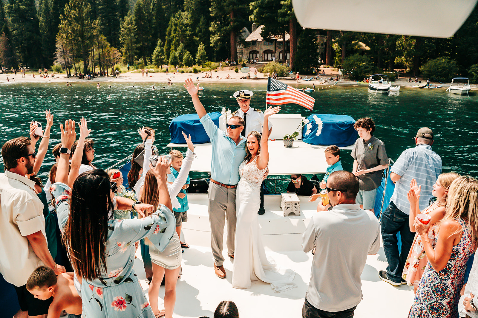 A bride and groom getting married on a party boat in Tahoe surrounded by friends and family
