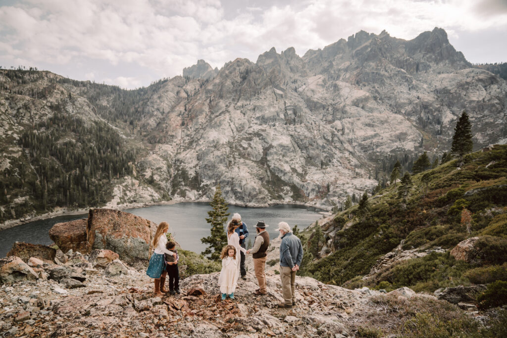 A couples elopement ceremony in the Sierra Buttes in Northern California with a lake and mountain backdrop