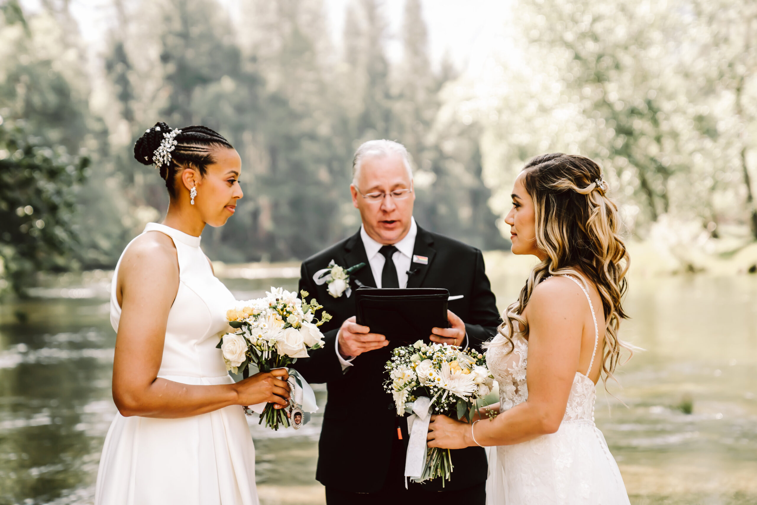 Two brides facing each other during their Yosemite Elopement Ceremony