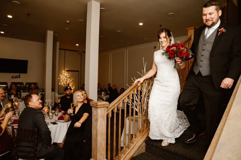 A bride and groom doing their grand entrance into the intimate wedding venue in Lake Tahoe