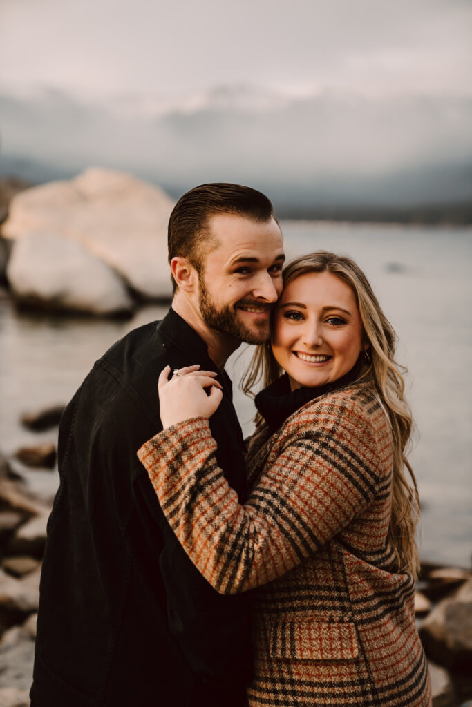 a recently engaged couple smiling