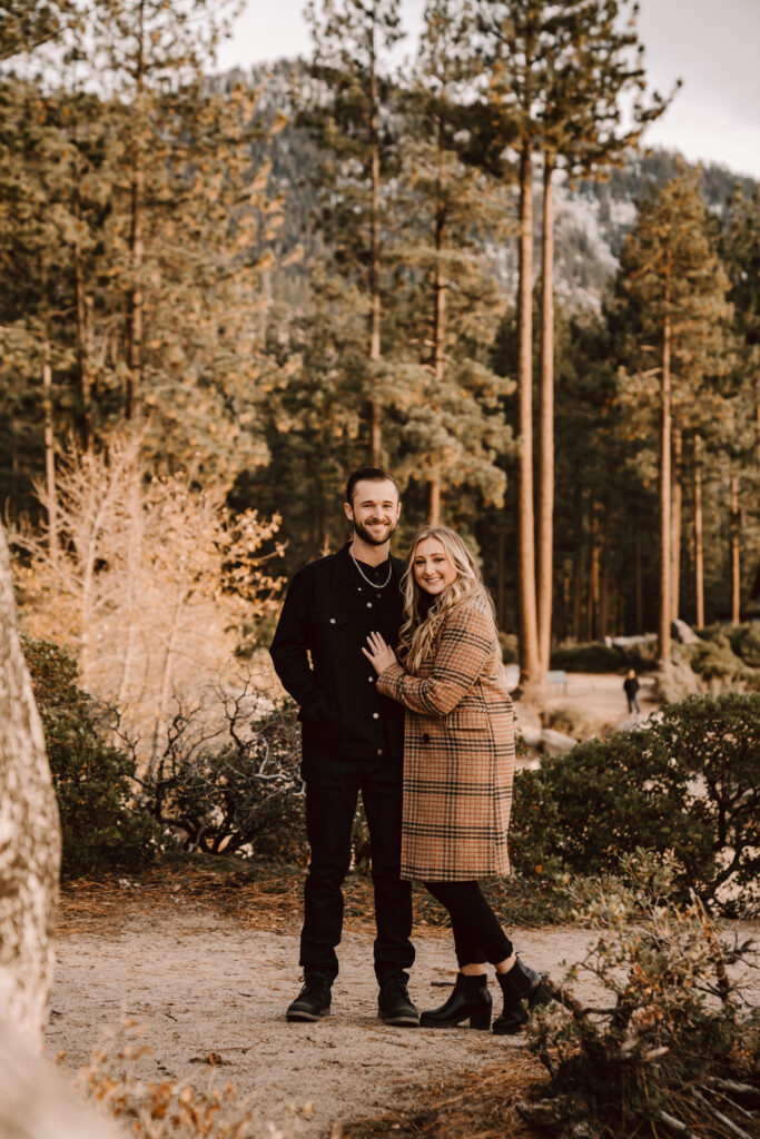 a recently engaged couple in the forest for some photos