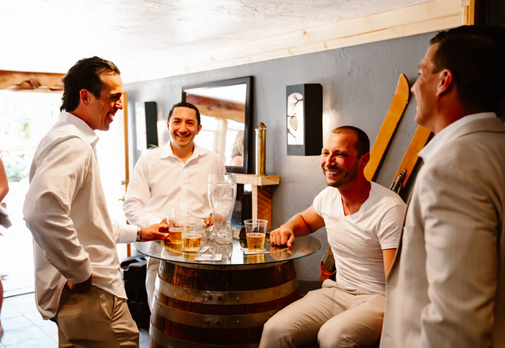 a groom and his groomsmen getting ready at the bar in Lakeview Social