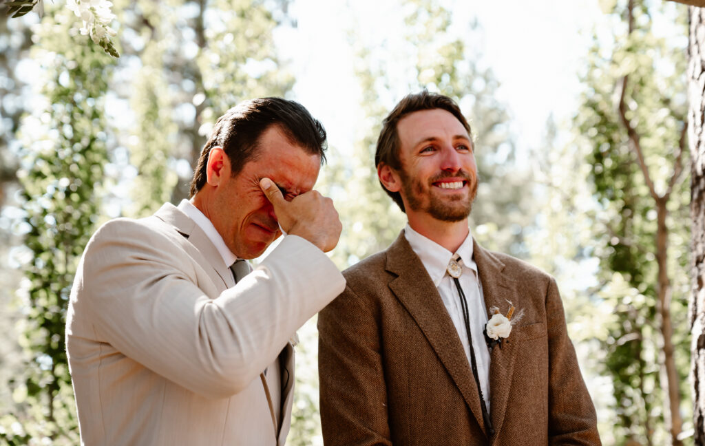 A groom seeing his bride for the first time coming down the aisle 