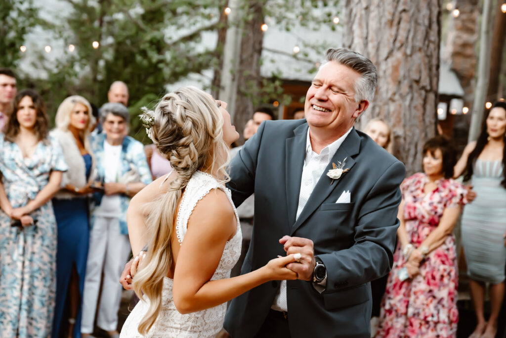 a bride dancing with her dad for the father daughter dance at their wedding