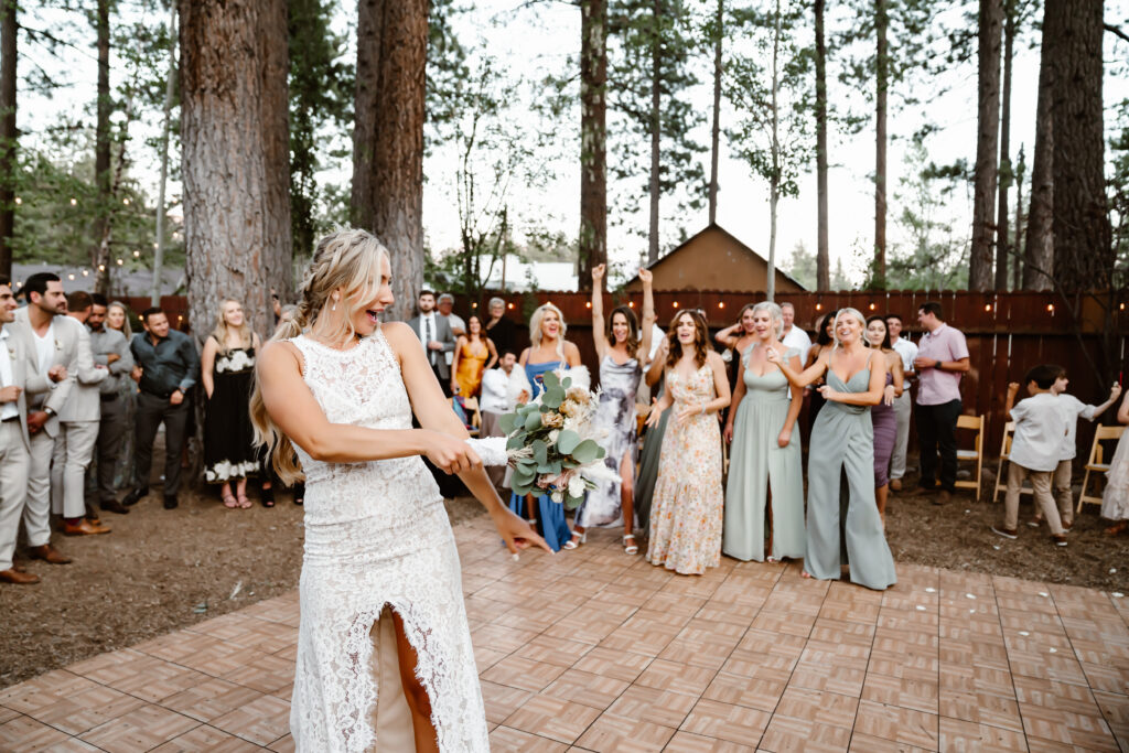 A bride tossing her bouquet on her wedding day