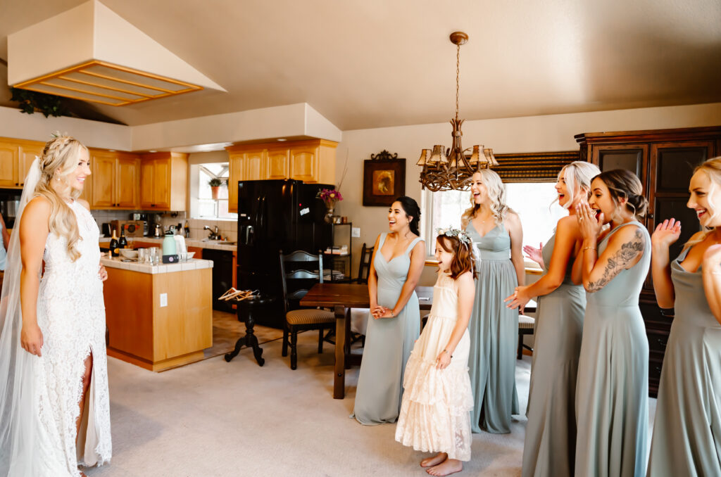 A first look with her bridesmaids while she is getting ready for her wedding day