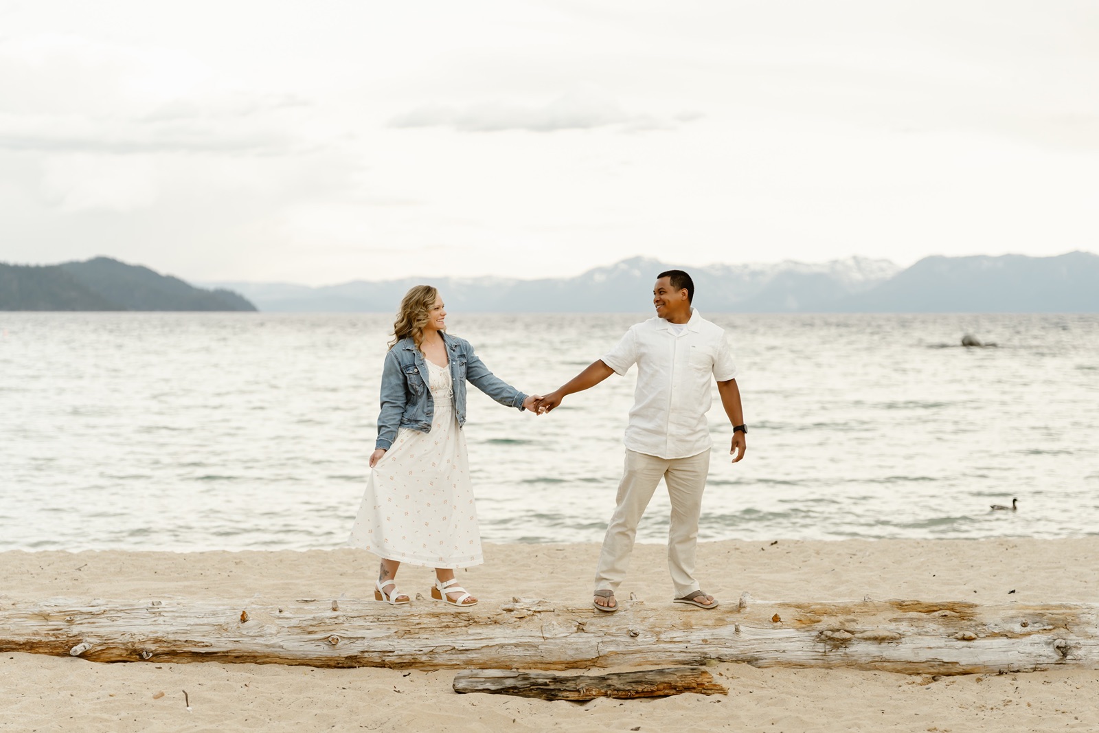 Couple on the beach at their Lake Tahoe engagement session