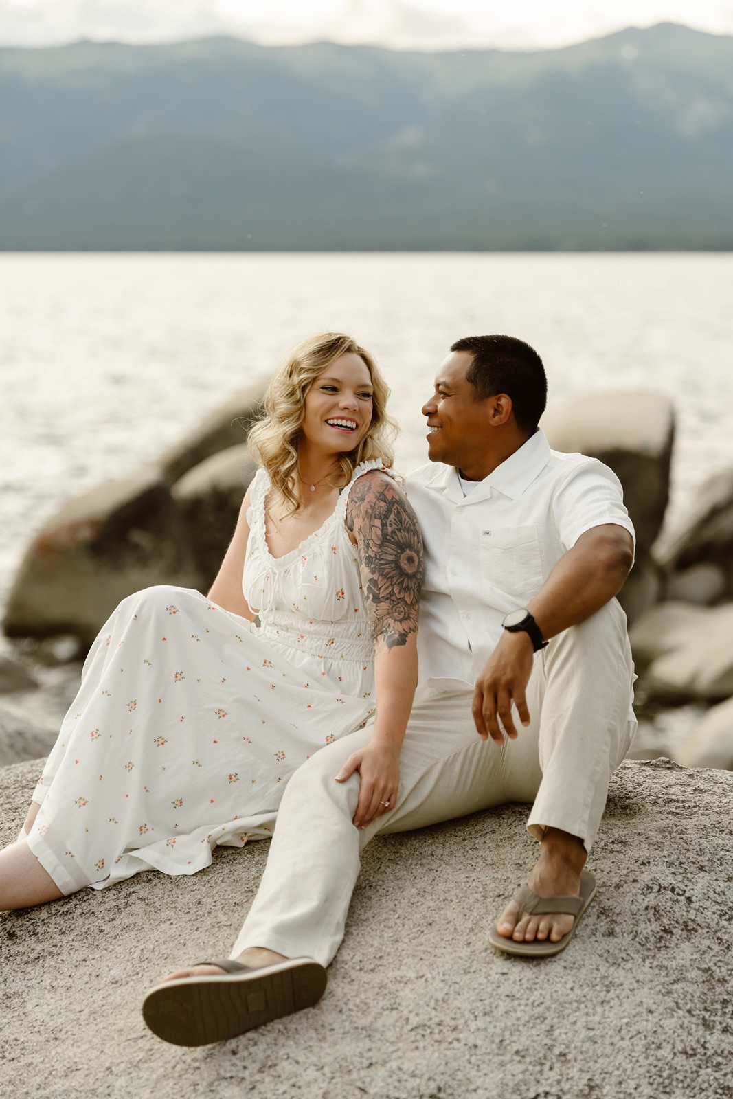 Man and woman pose for engagement photos at Sand Harbor