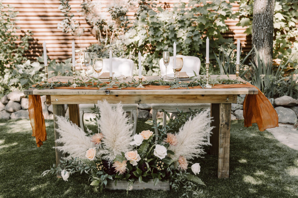Head table wedding decorations with boho flowers