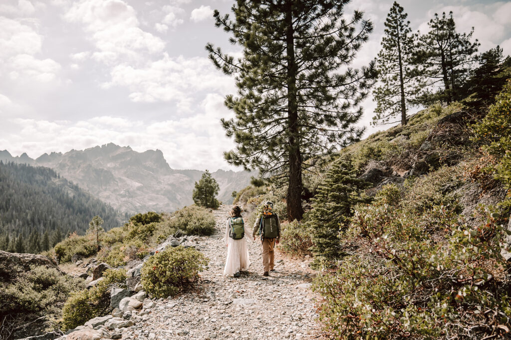 a bride and groom hiking in the Sierra Nevadas for their elopement day