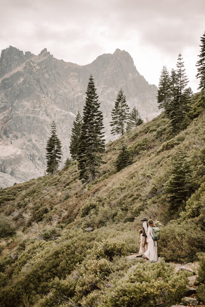 a Bride and groom hiking to the Sierra Buttes on their elopement day
