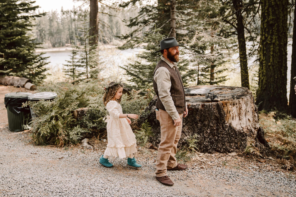 Dad and daughter doing a first look in the forest on his elopement day