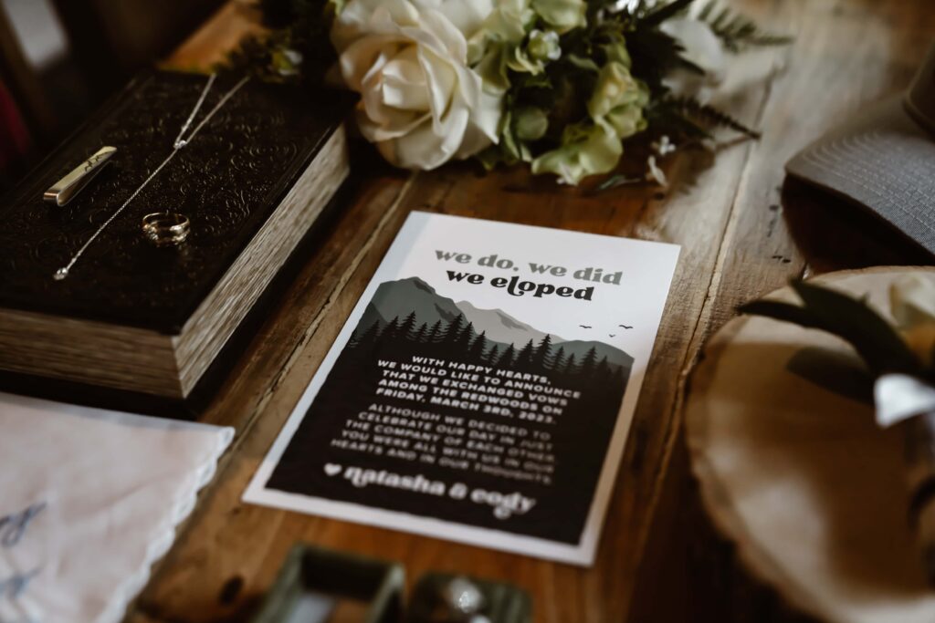 a "We Eloped" card as wedding details for a redwood elopement day