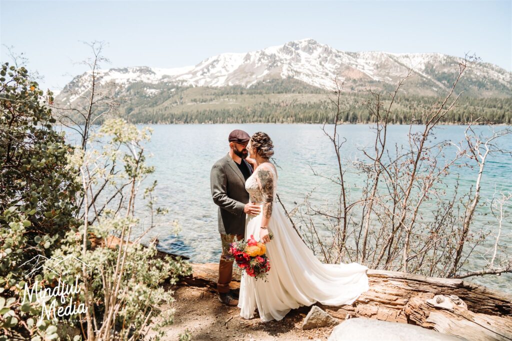 A couple standing in front of Leave Lake and Mount Tallac for their elopement day in Lake Tahoe