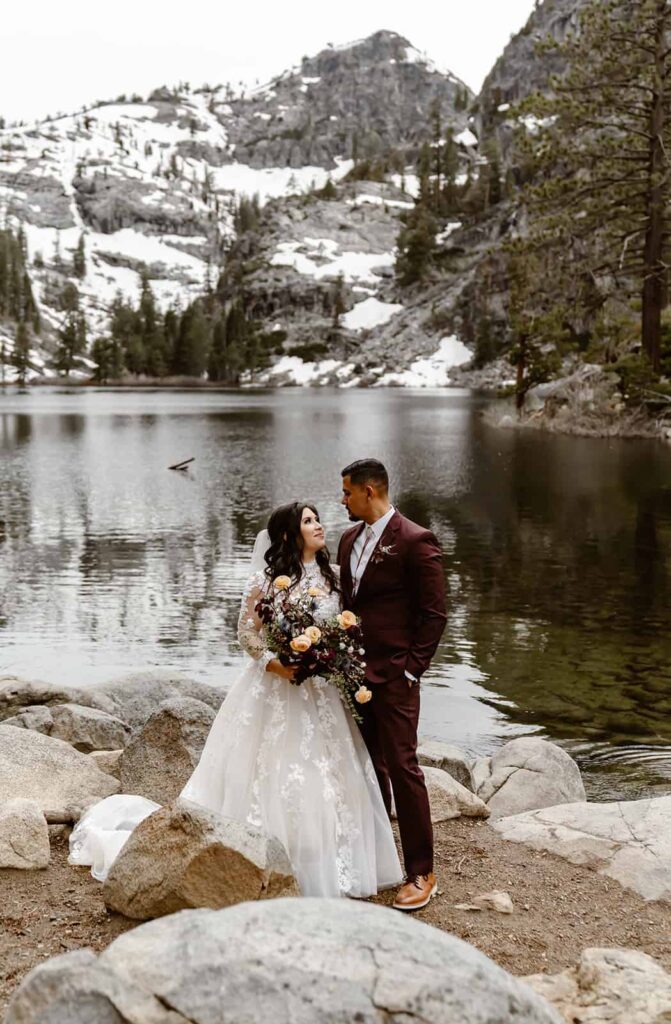 A wedding couple standing in front of Eagle Lake for their Lake Tahoe Elopement