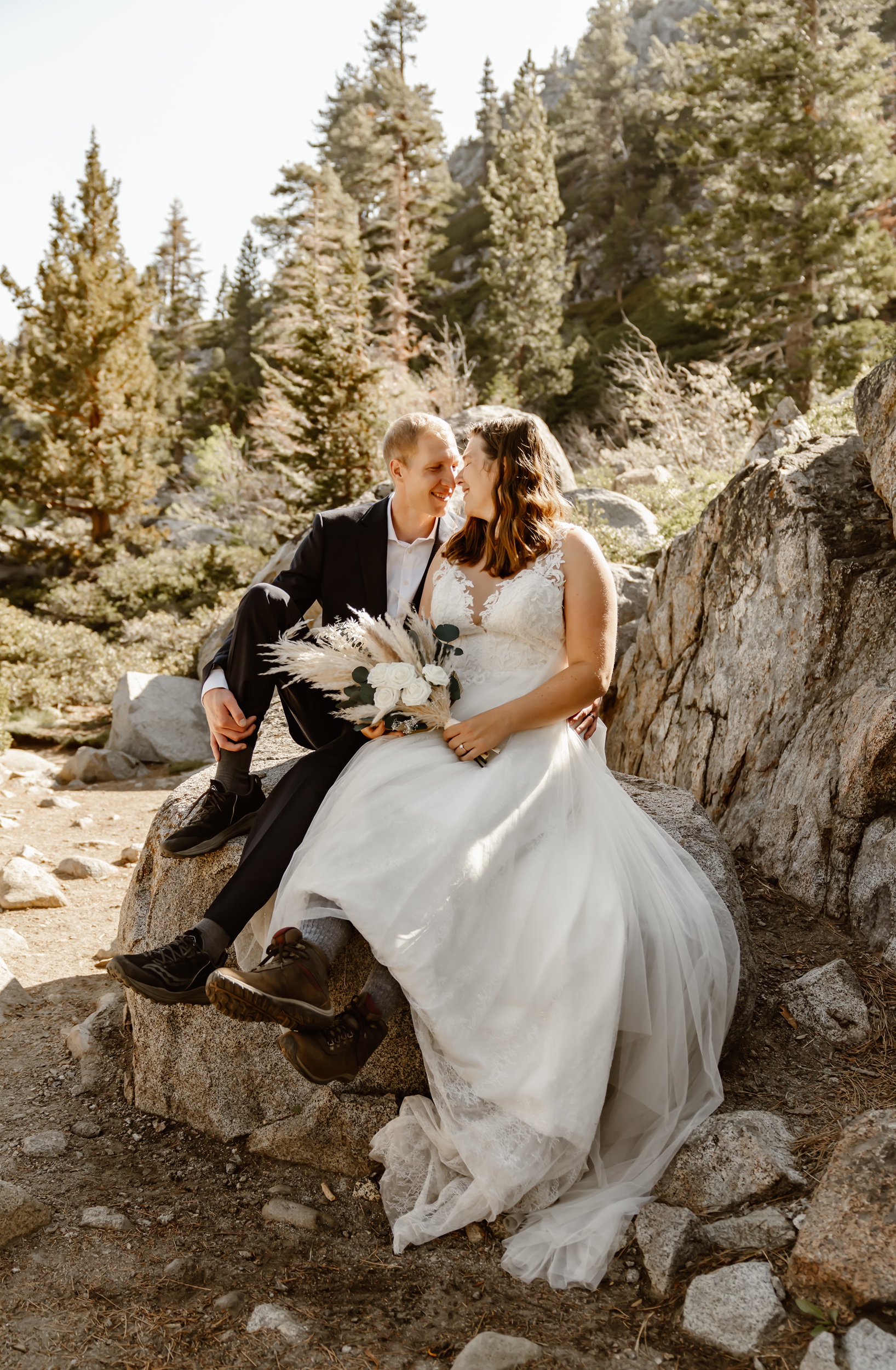 Bride and groom pose during adventure elopement at Emerald Bay