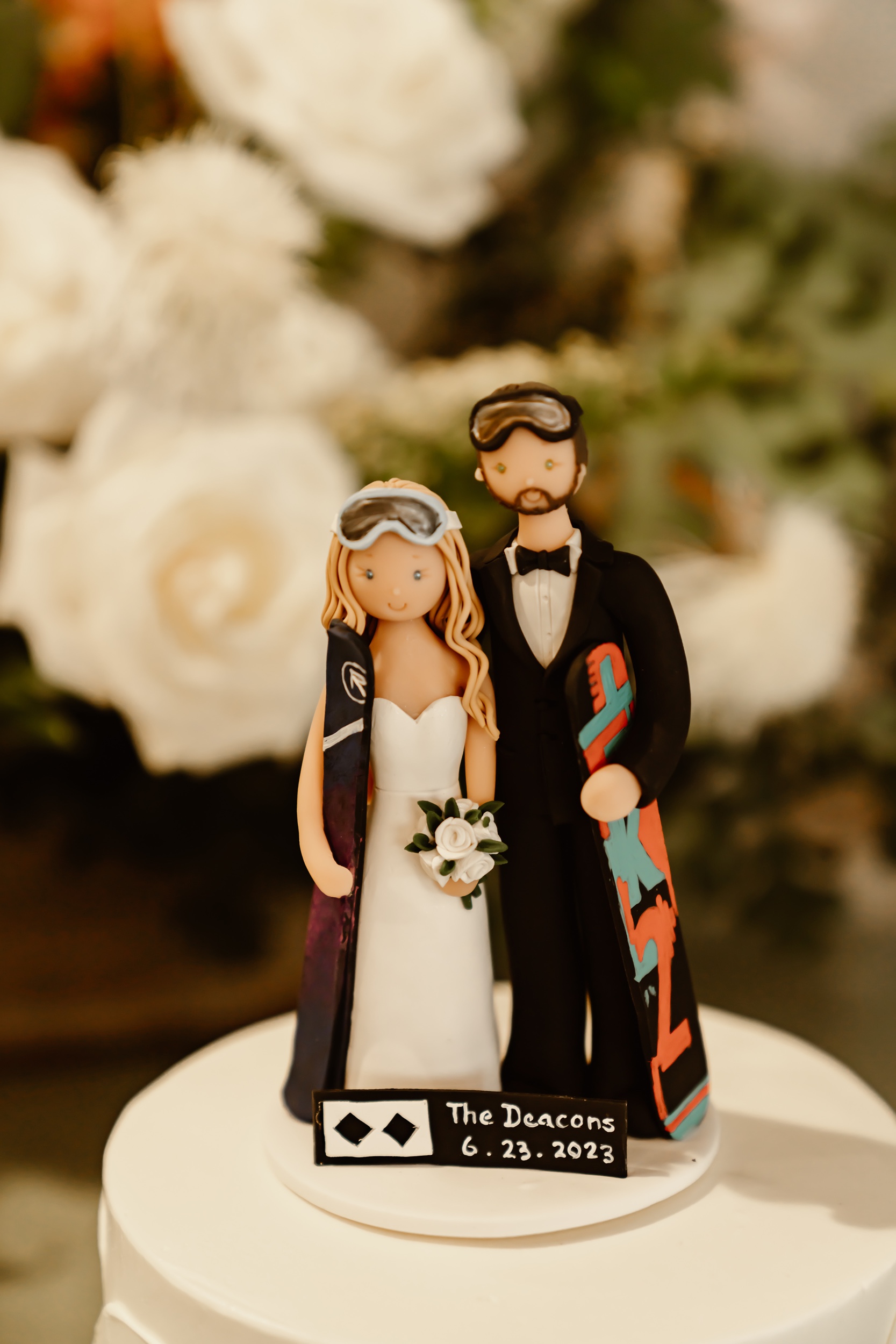 cake topper with skis at adventure wedding
