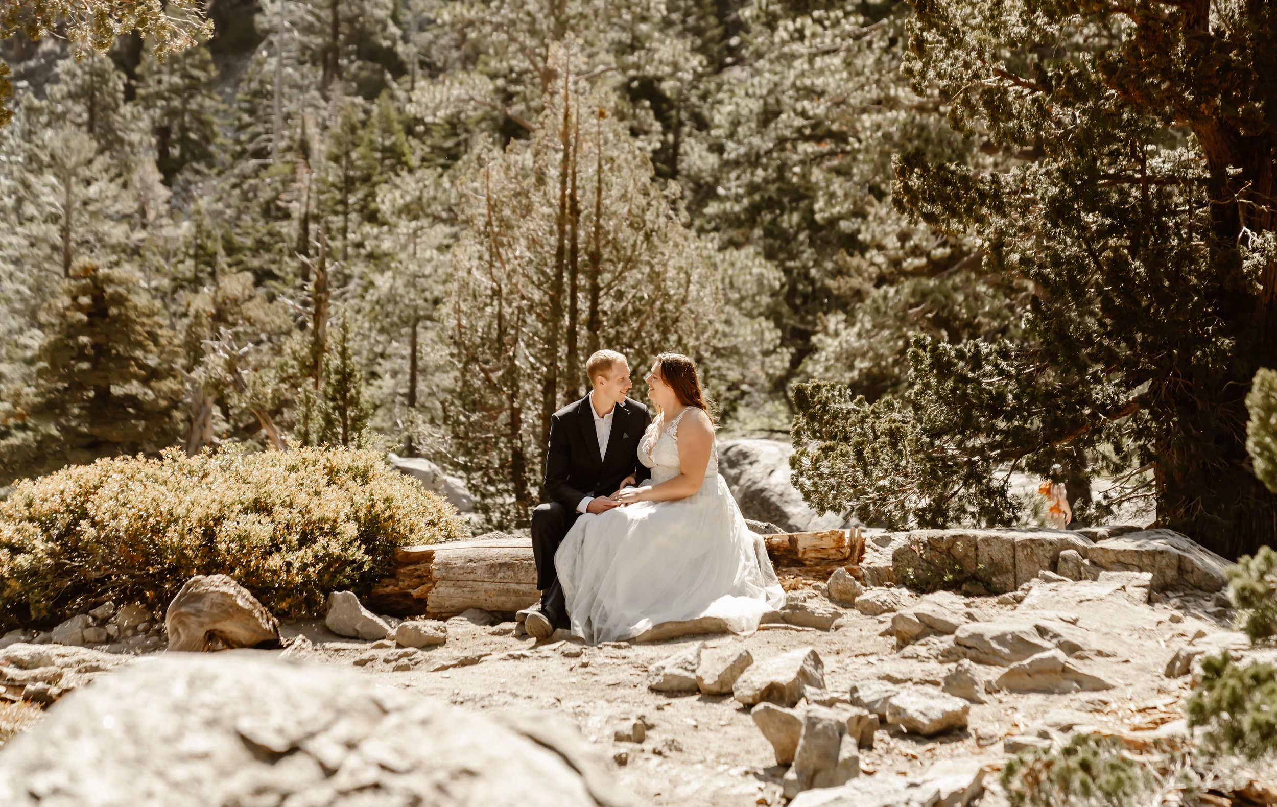 Couple sits after Emerald Bay elopement ceremony