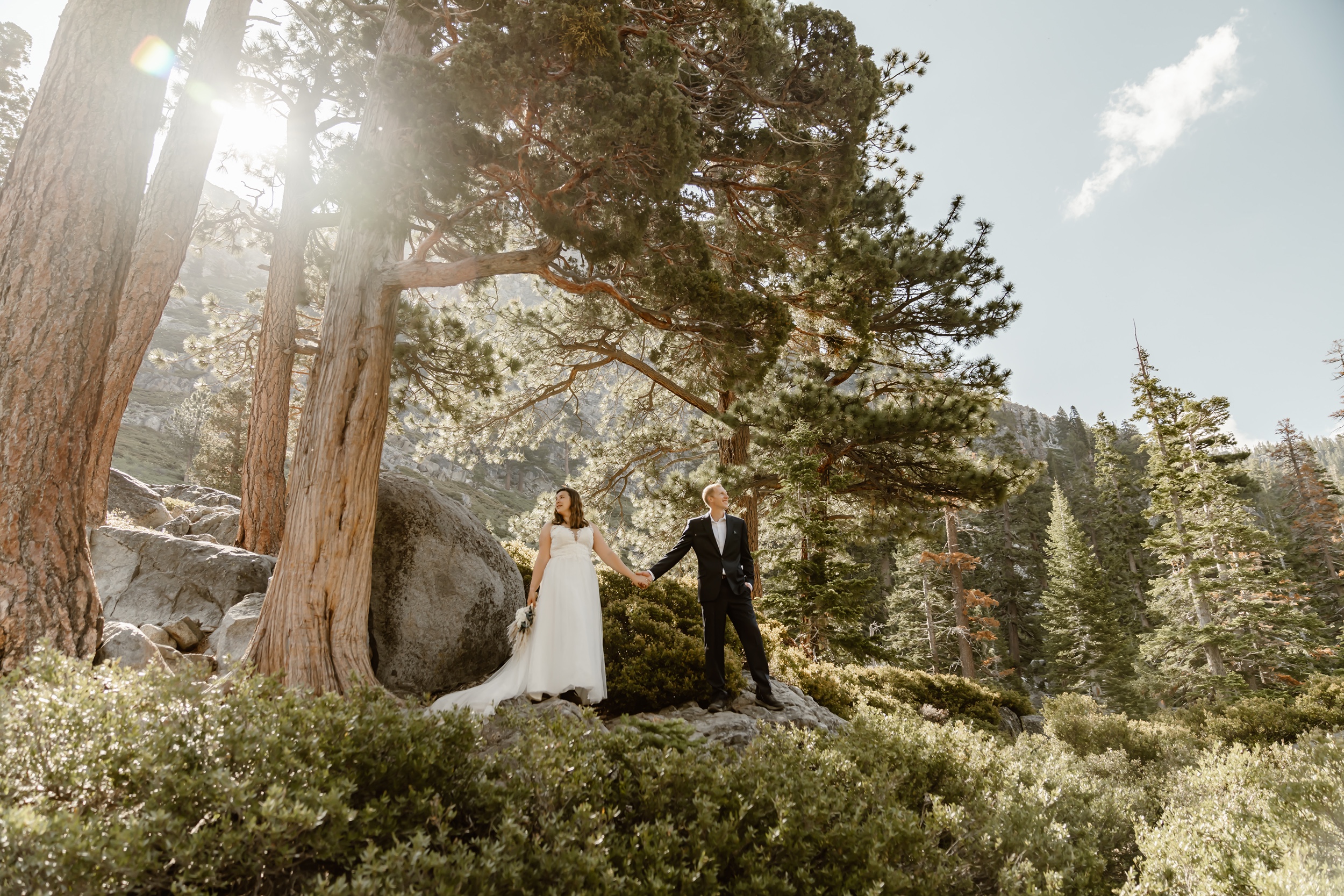 Bride and groom hold hands during Emerald Bay elopement photography