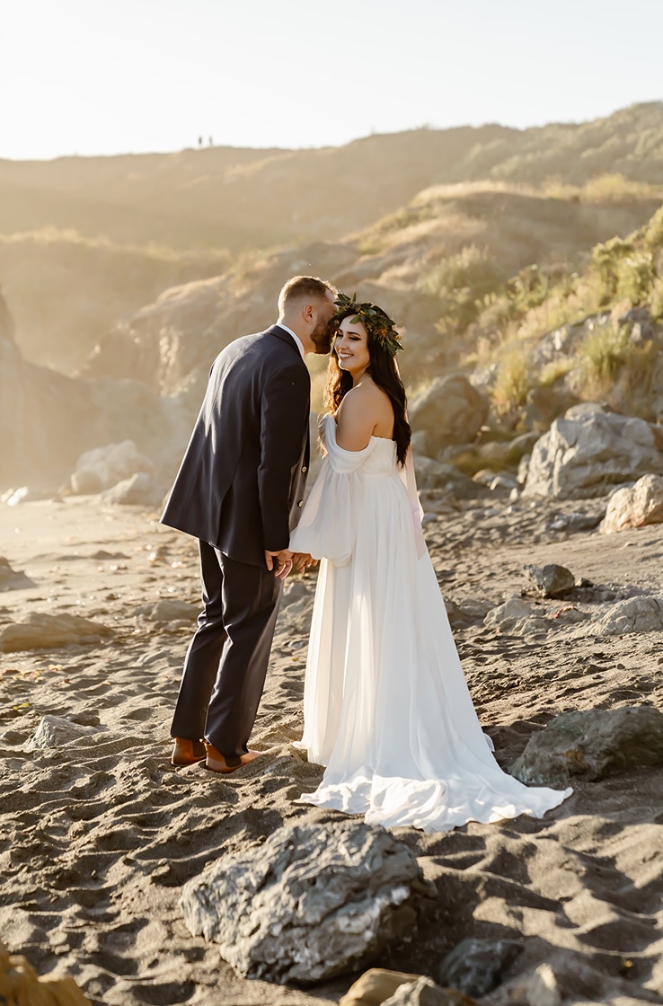 Couple pose for Goat Beach Lookout elopement pictures