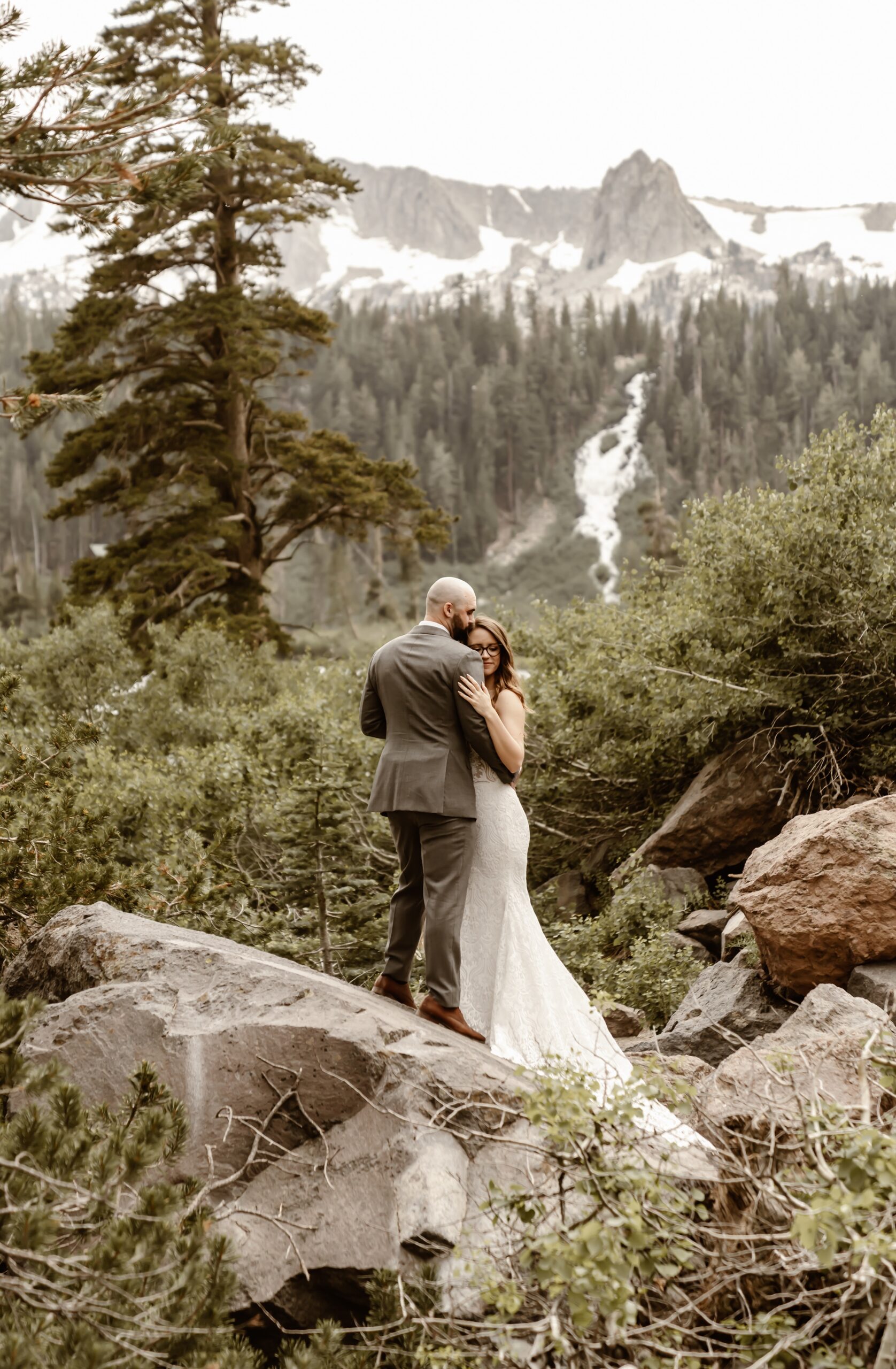 Bride and groom hug during couples photos
