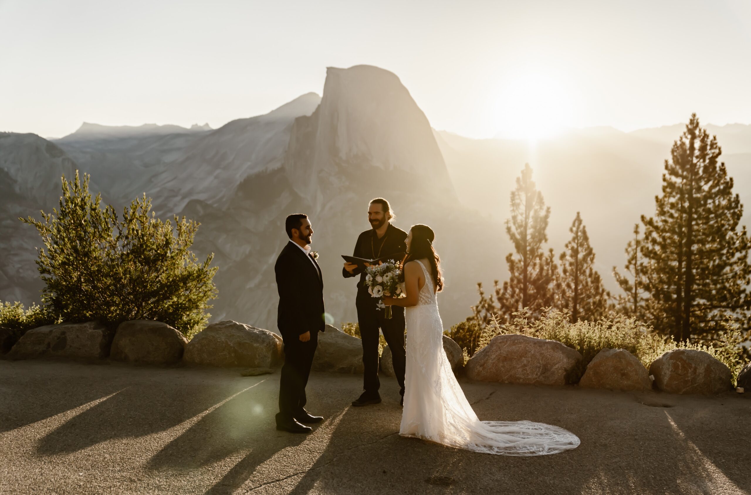 Bride and groom say vows at Glacier Point Amphitheater wedding ceremony