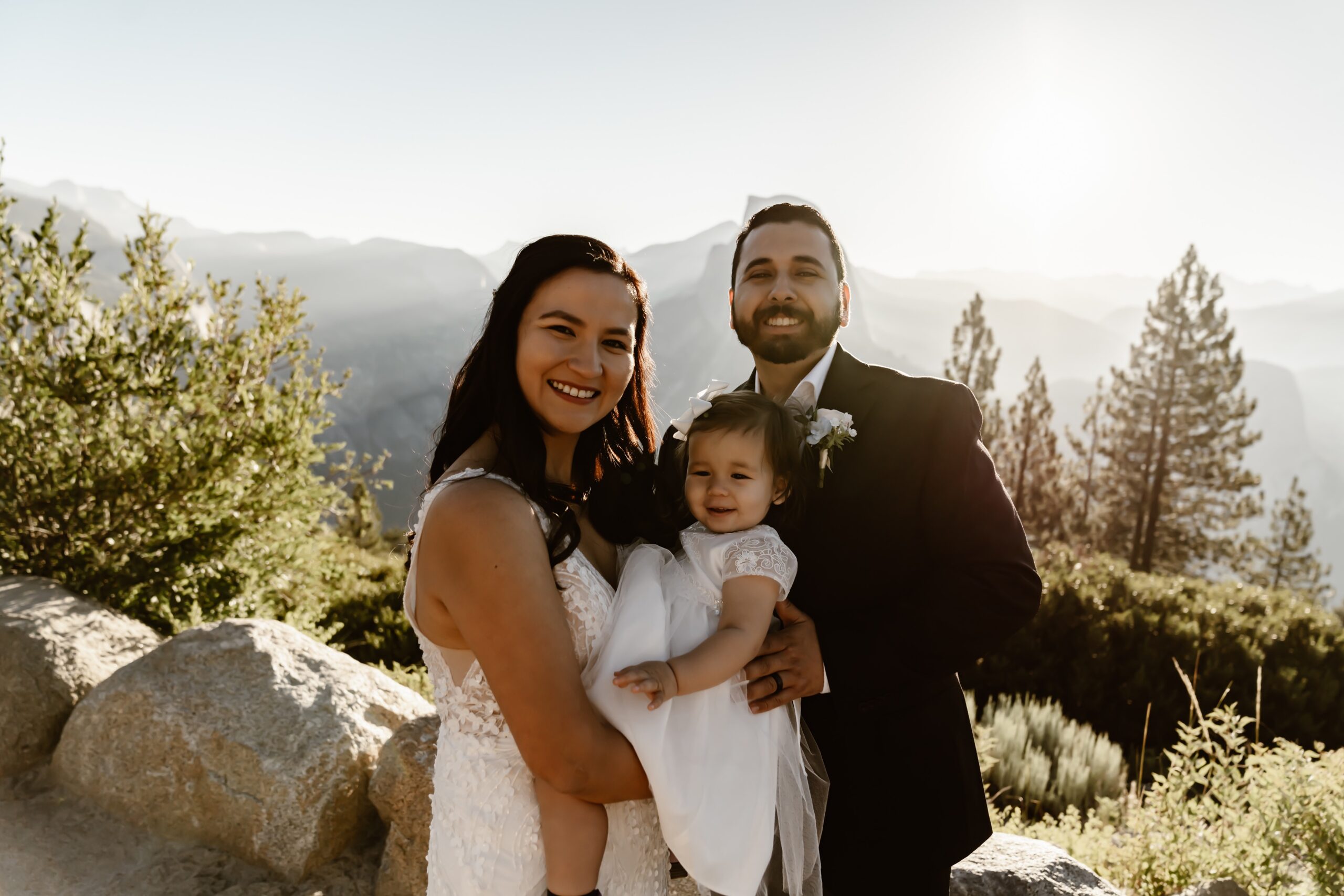 Bride and groom with baby at Yosemite wedding