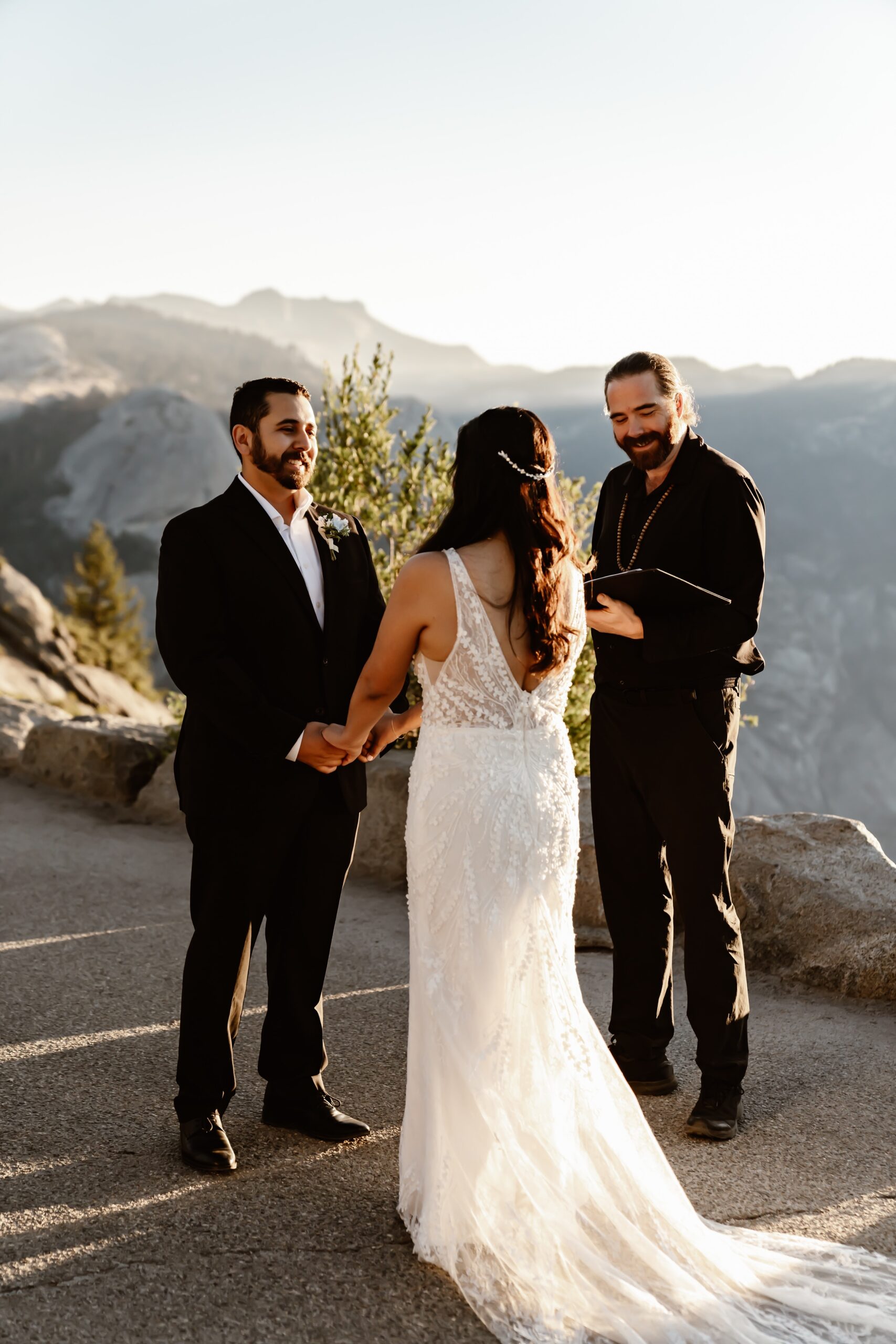 Bride and groom say vows at Glacier Point Amphitheater wedding ceremony