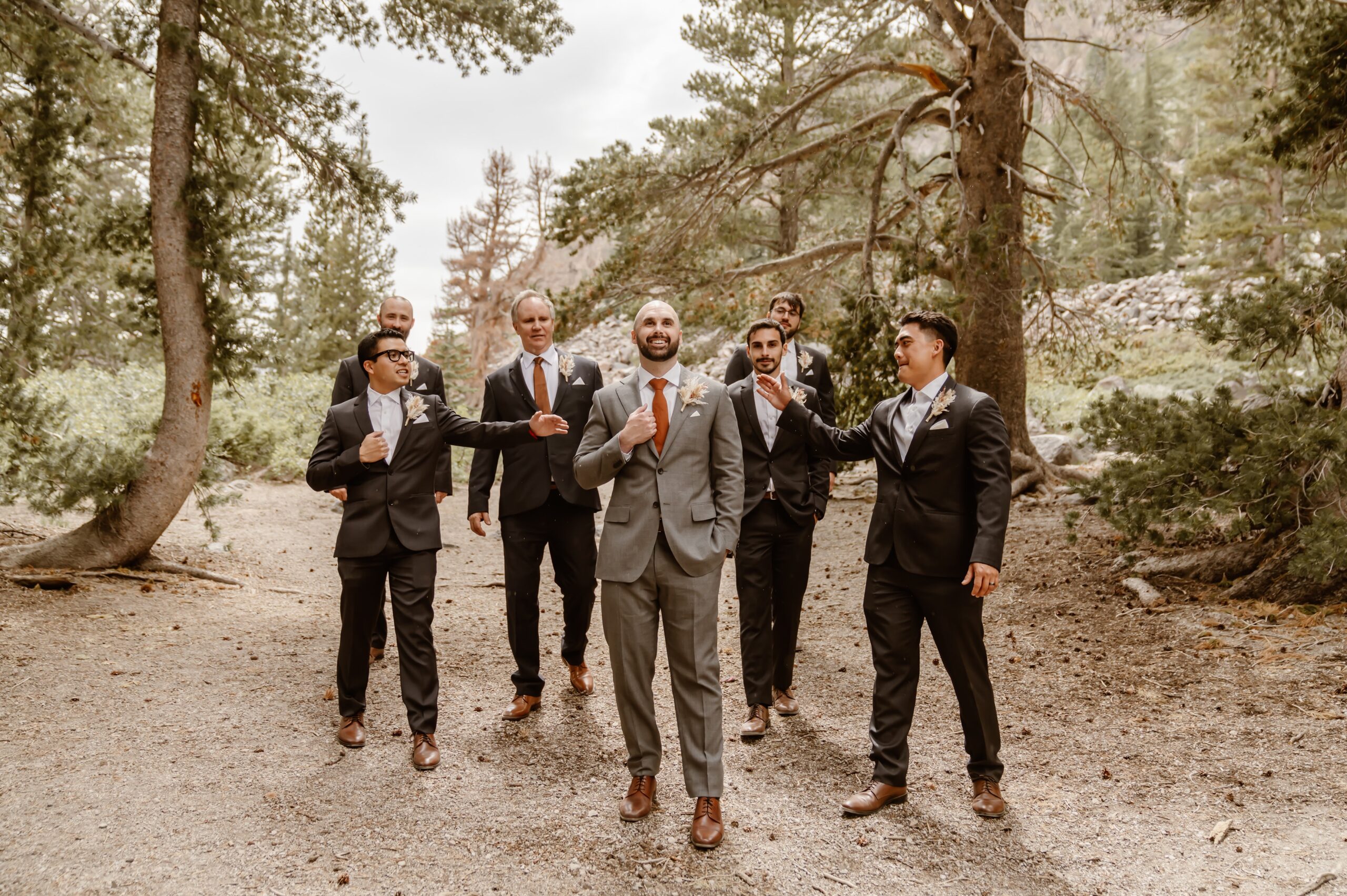 Groom and groomsmen pose for portraits