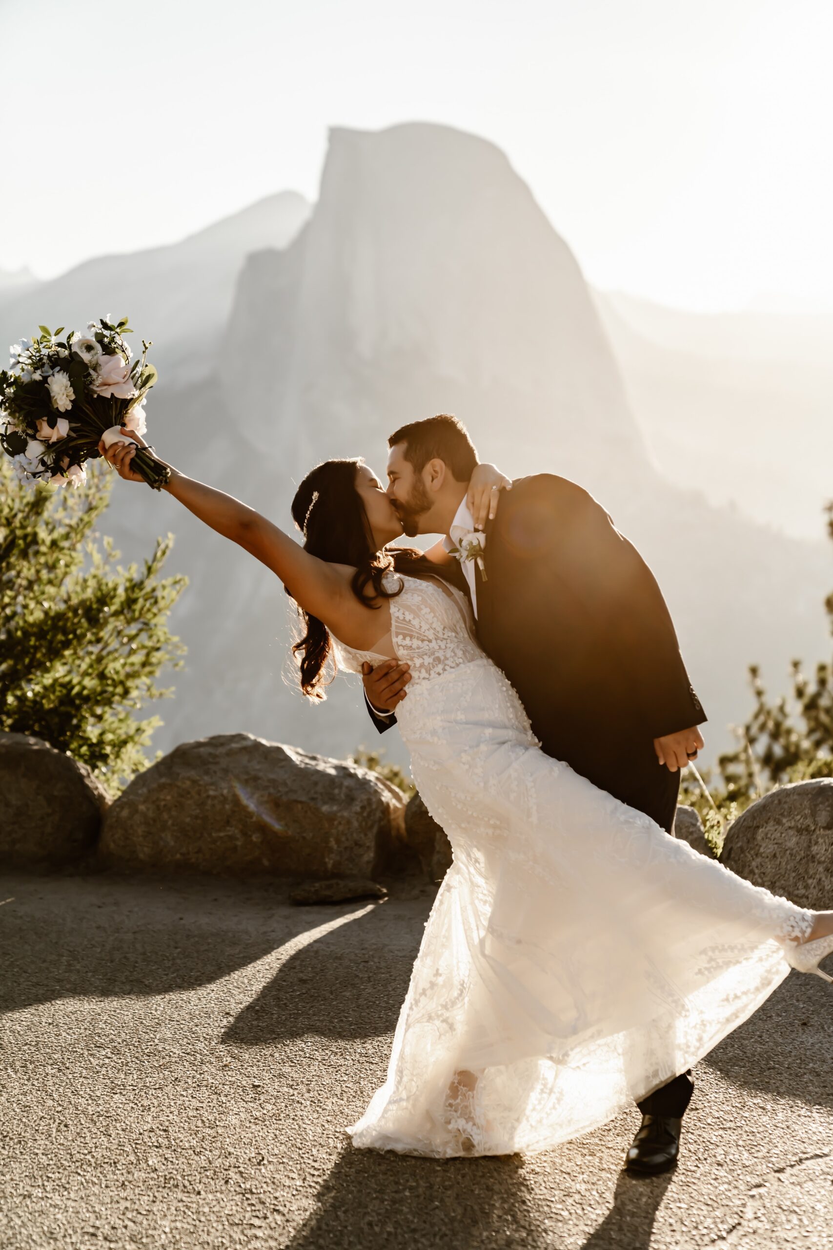 Bride and groom kiss during Glacier Point wedding photos