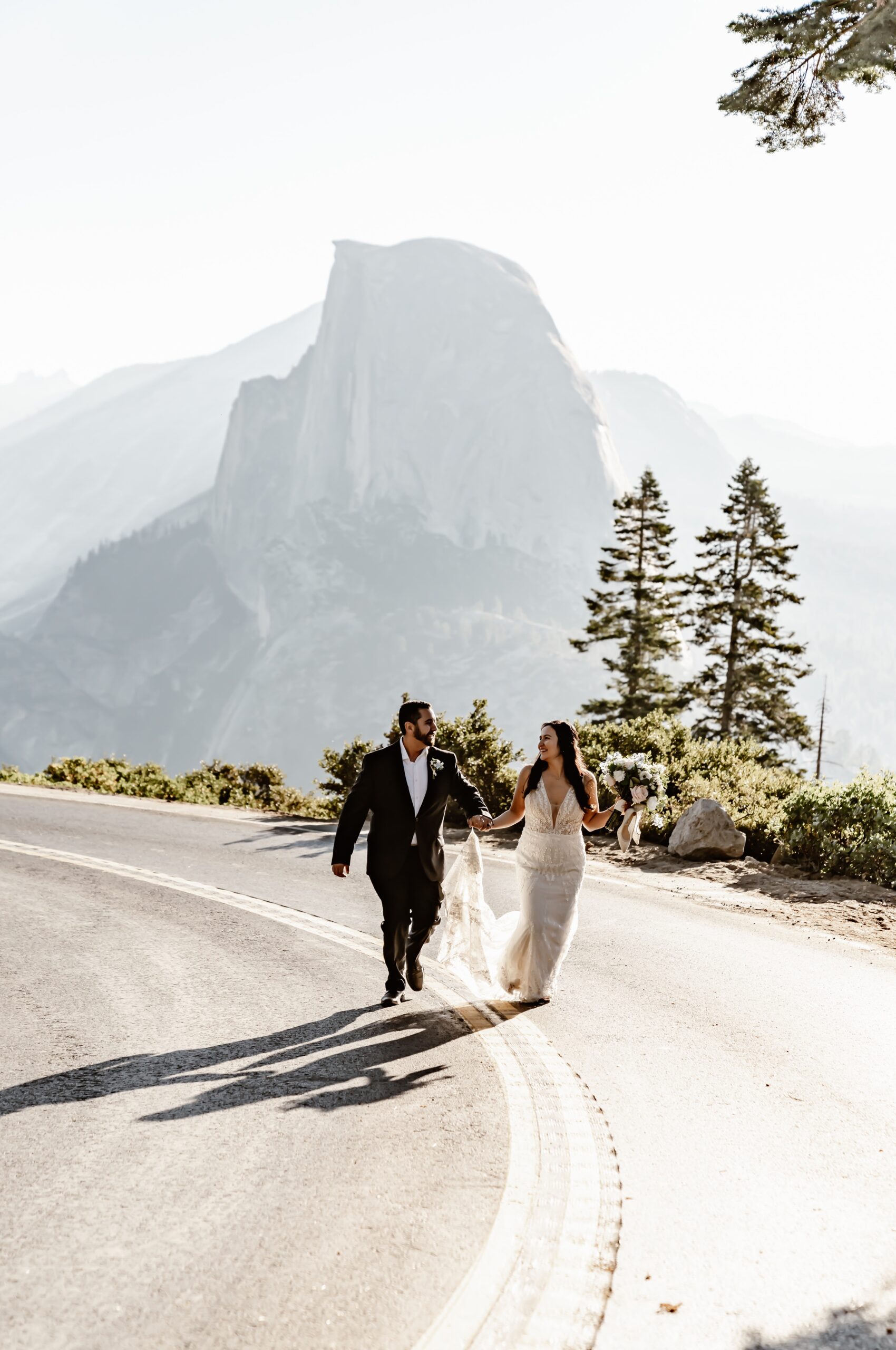 Wedding couple explores Yosemite at sunrise