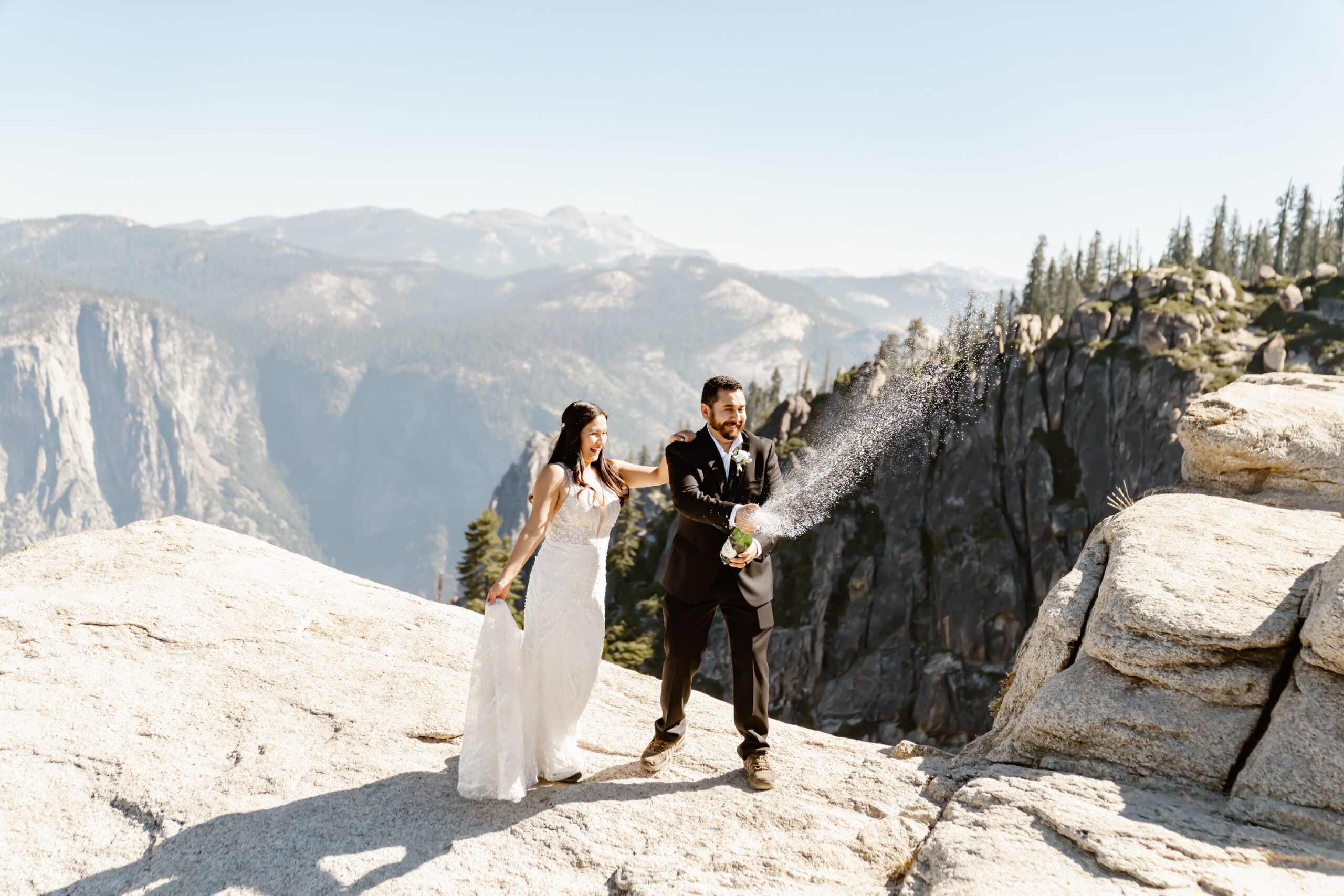 Couple pops champagne at Taft Point