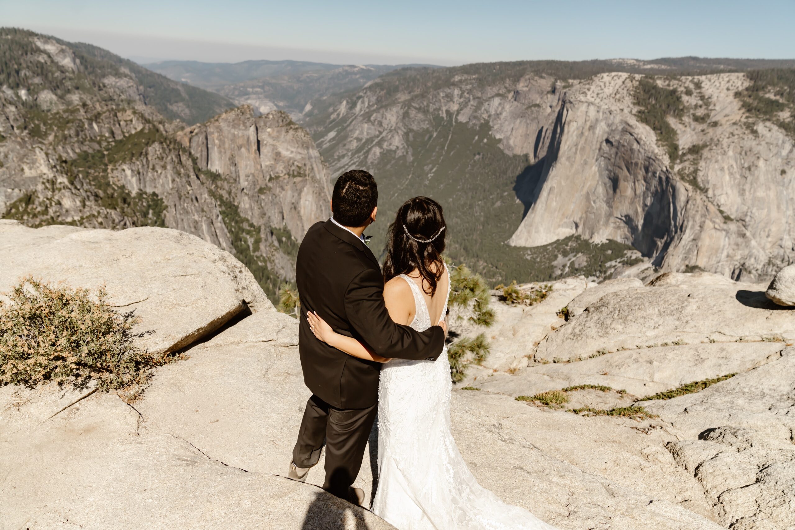 Bride and groom take in the views of Taft Point
