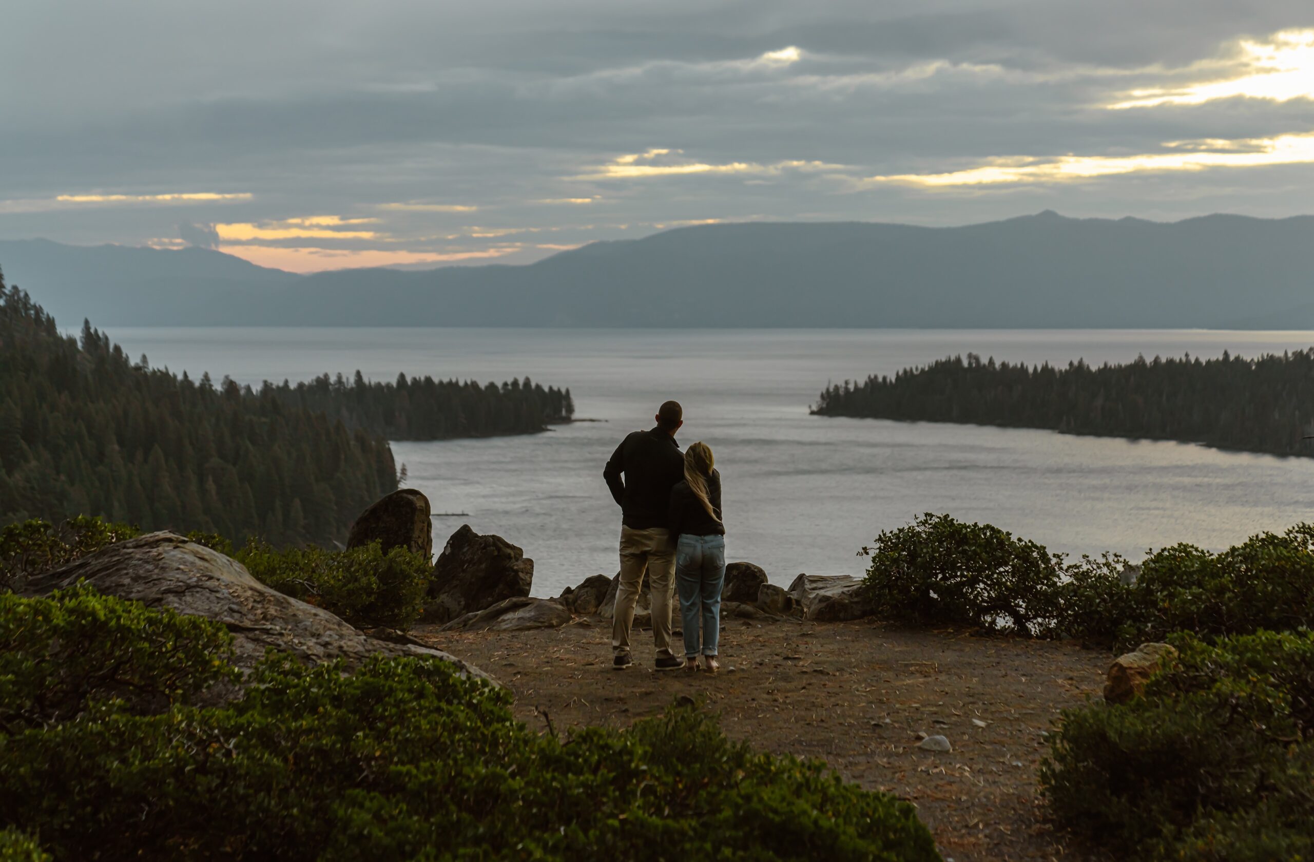 Man and woman look out over Lake Tahoe