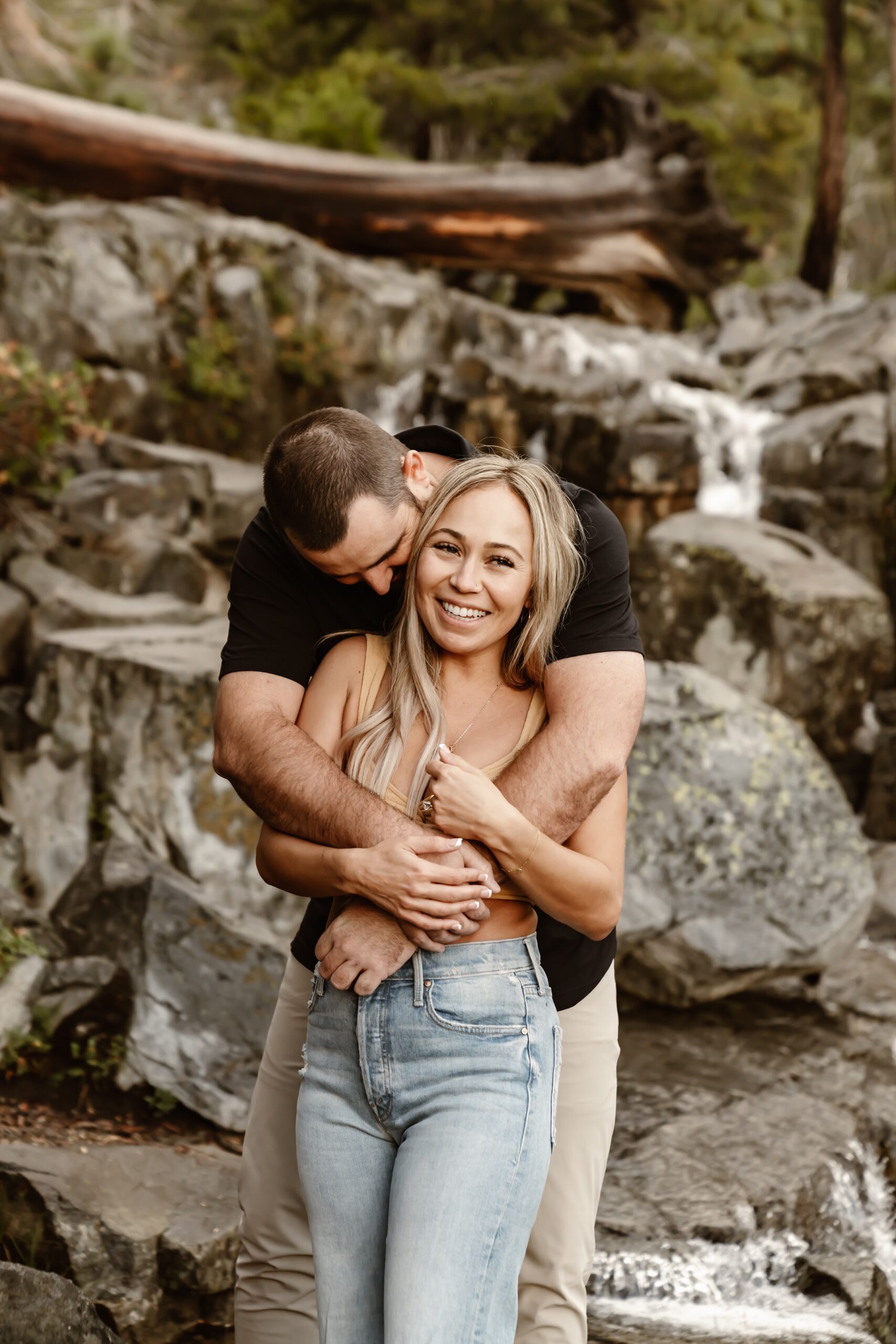 Man and woman hug at Lake Tahoe engagement photoshoot