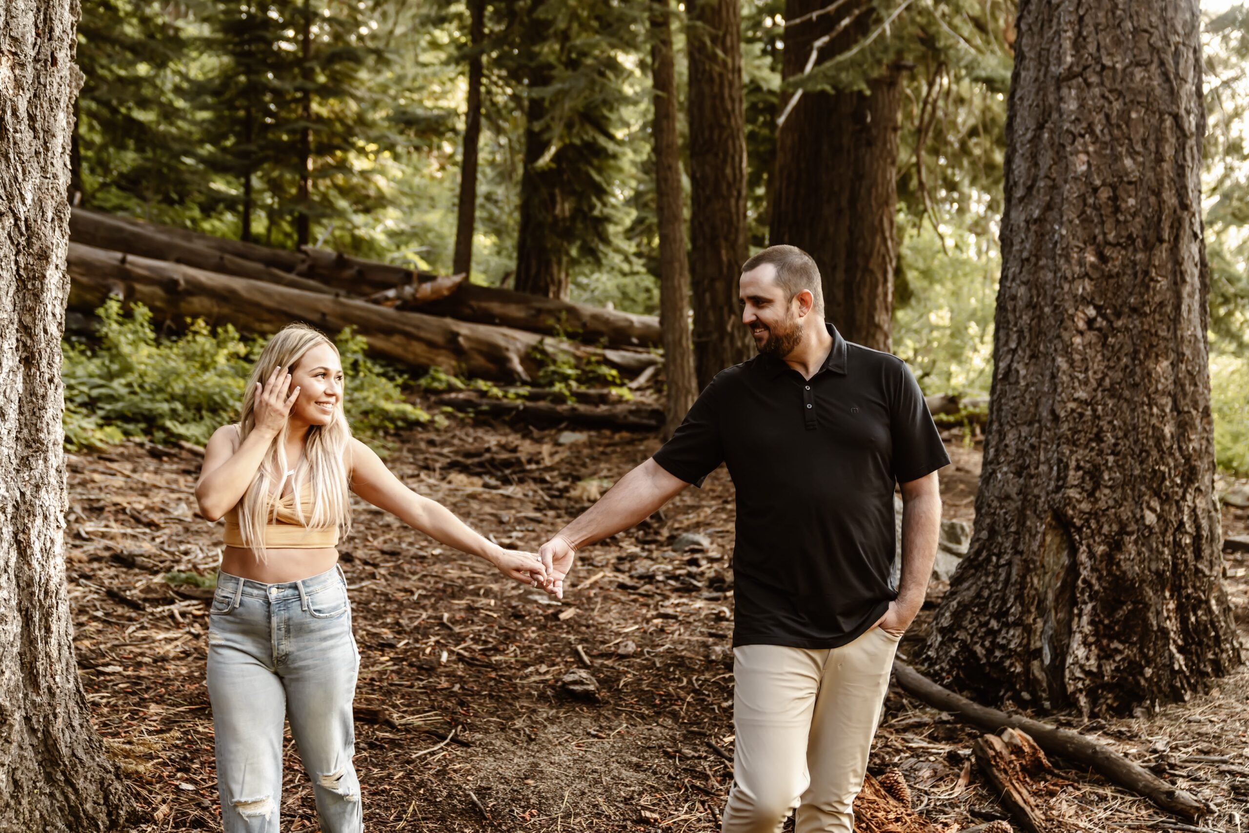 Man and woman hold hands at Lake Tahoe