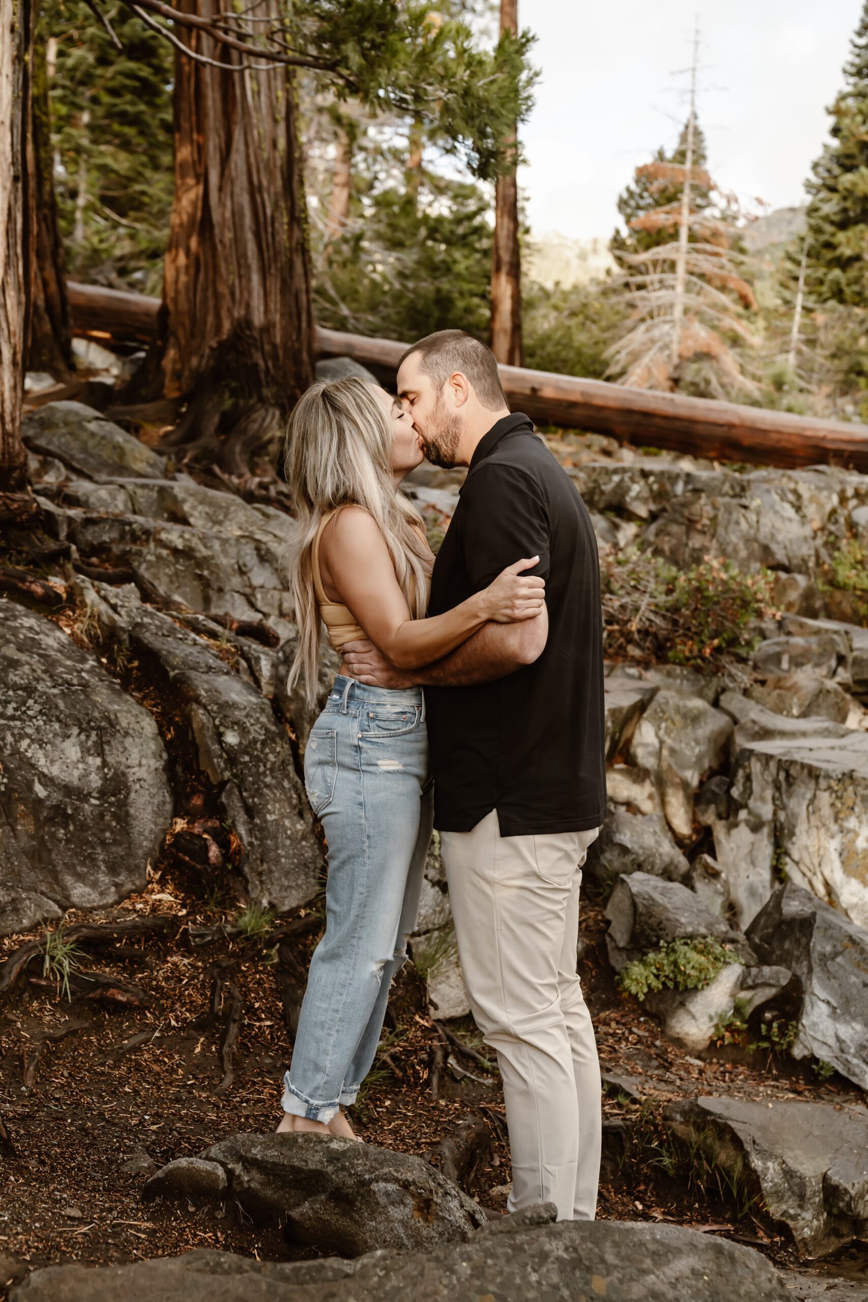 Man and woman kiss at Emerald Bay in Lake Tahoe