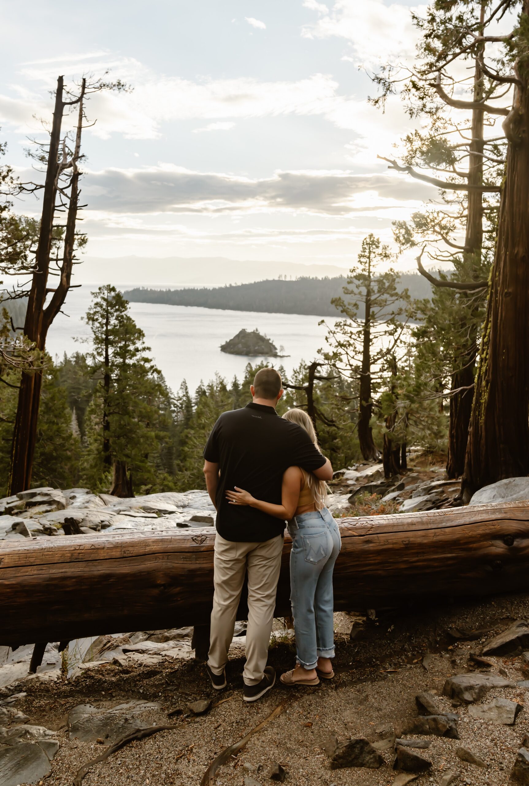 Couple looks out at Lake Tahoe during engagement session