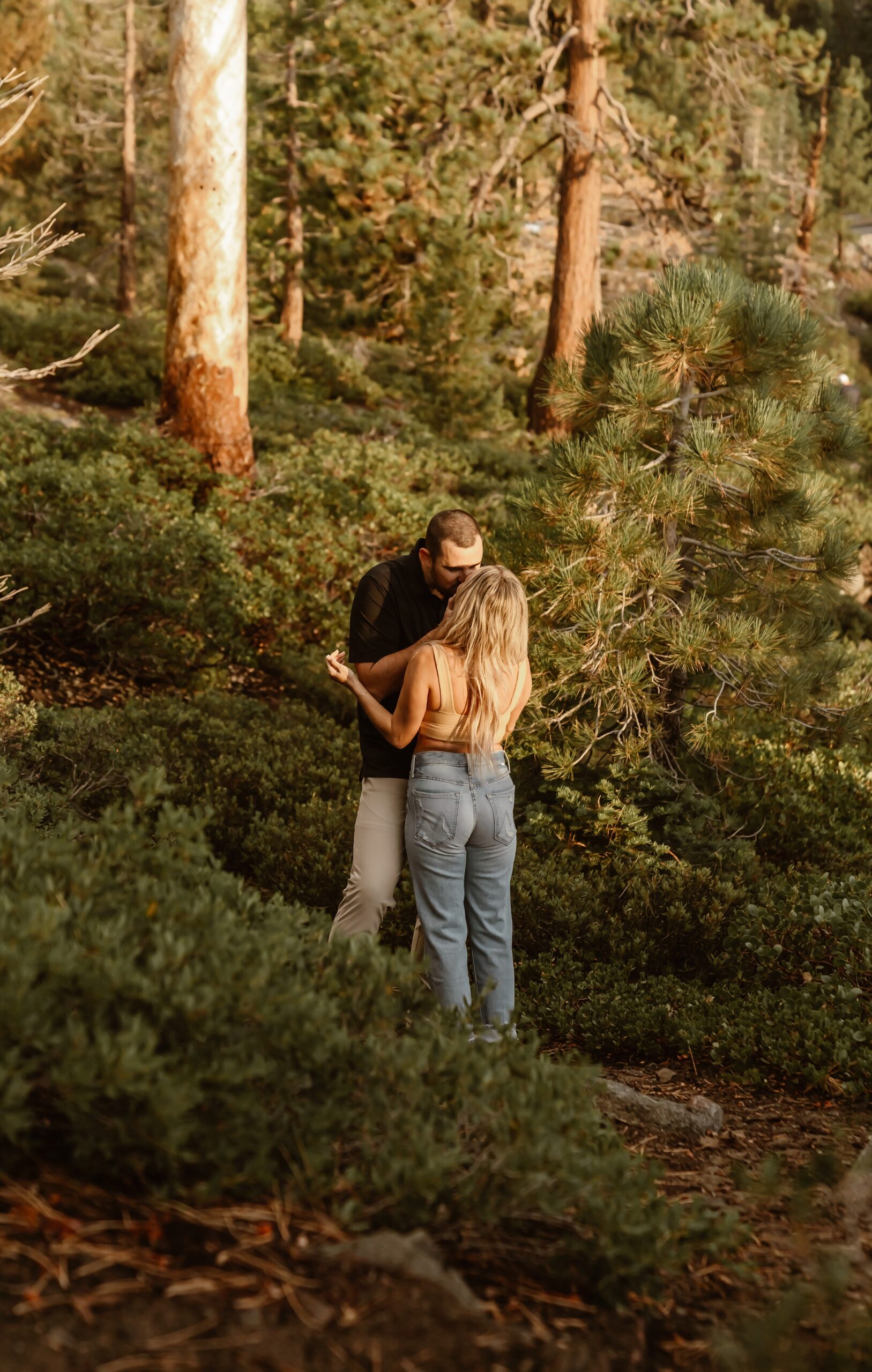 Couple kisses during sunrise Lake Tahoe couples portraits