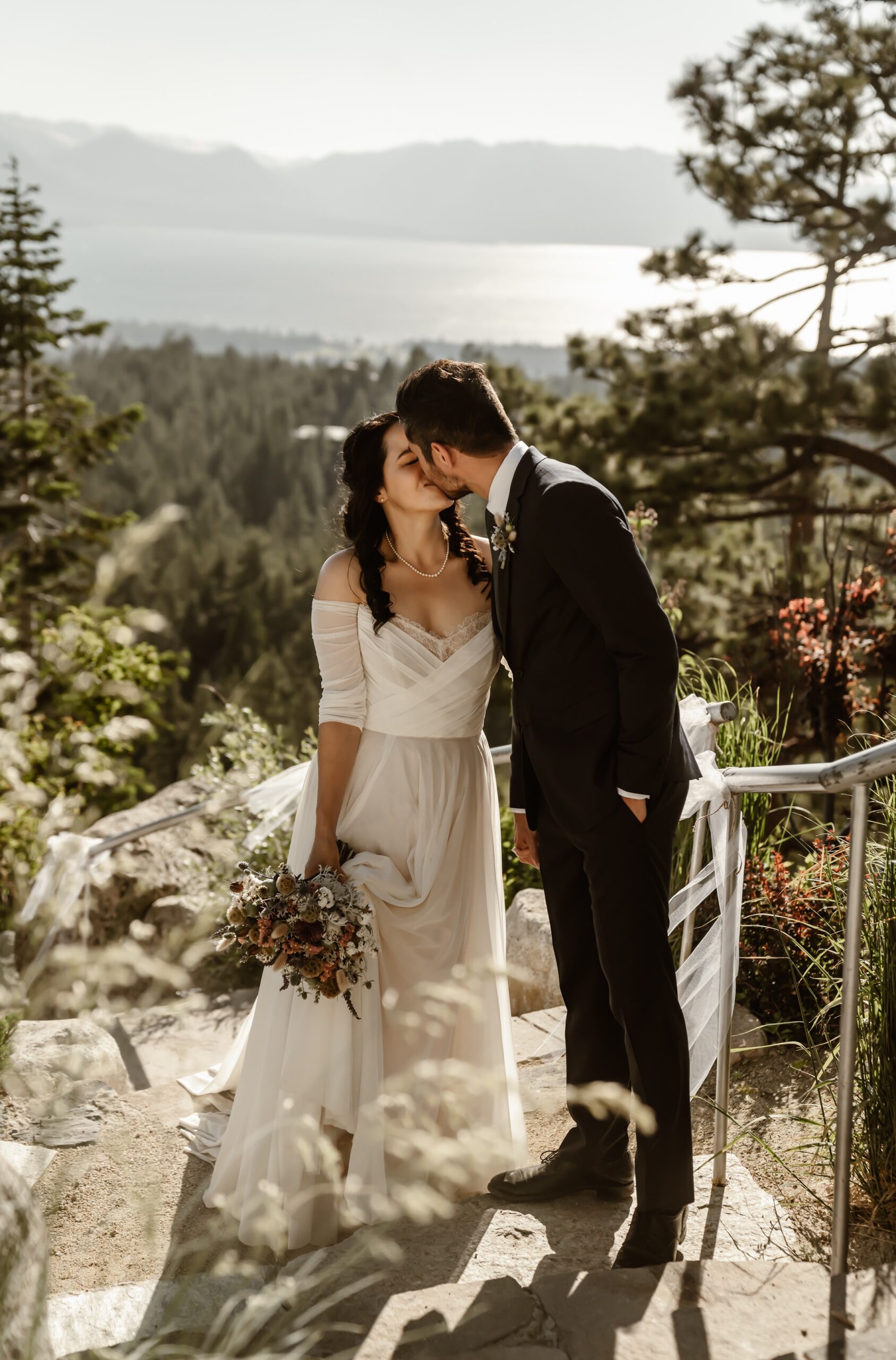 Bride and groom kiss during Tahoe Blue Estate wedding photos