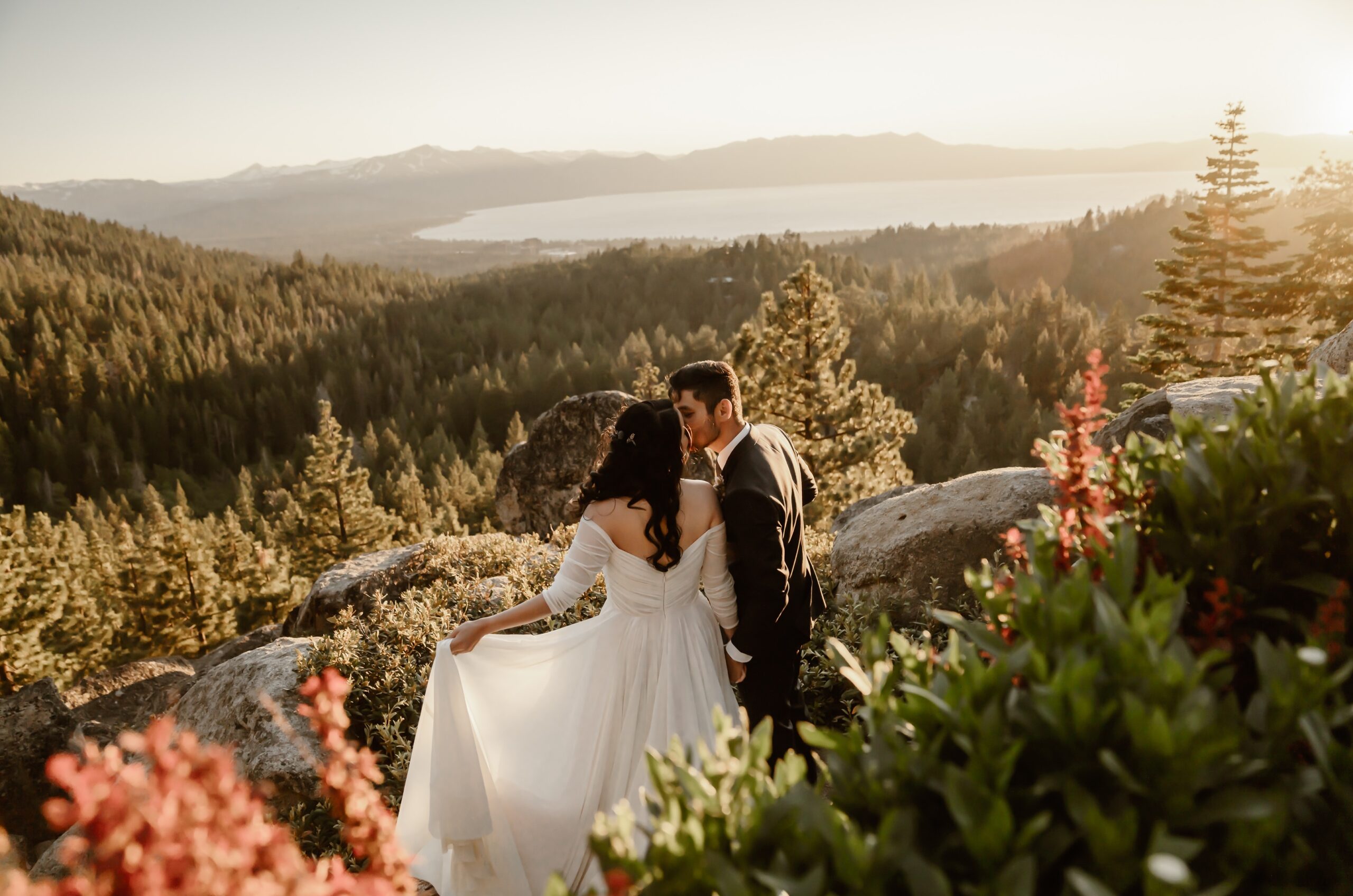 Couple kisses with Lake Tahoe backdrop