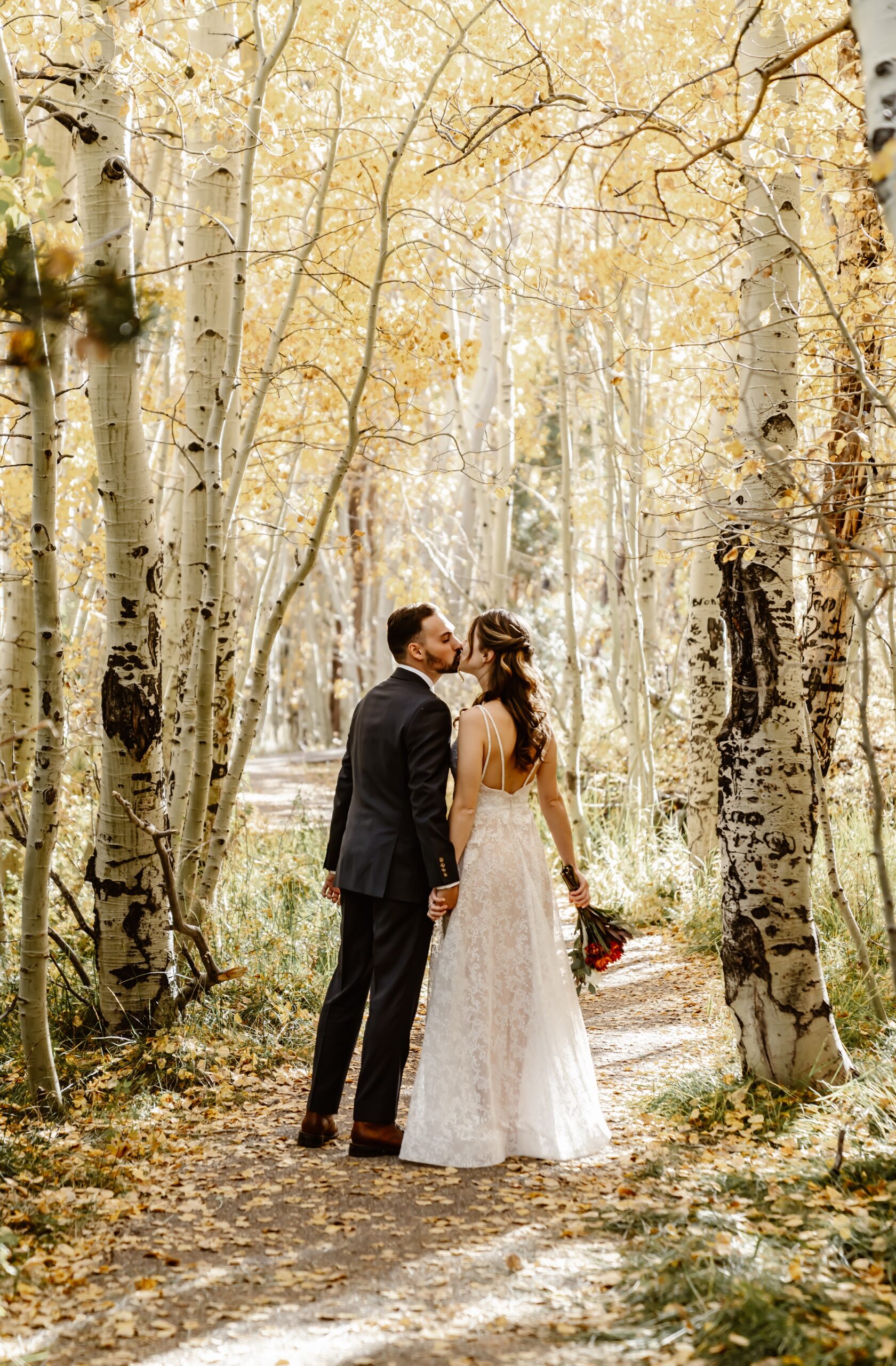 Bride and groom kiss in Mammoth Lakes