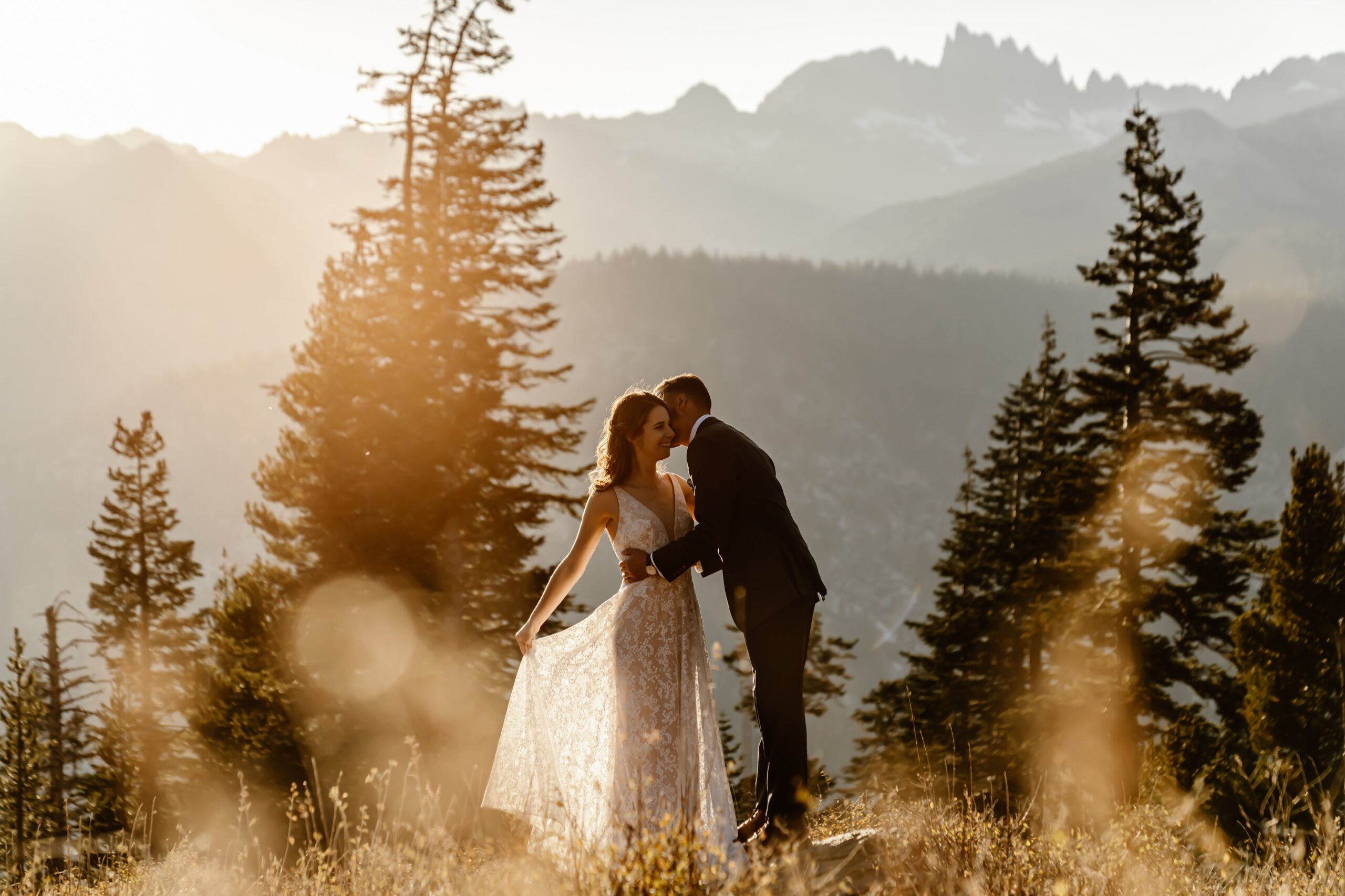 Bride and groom kiss at sunset in Mammoth Lakes